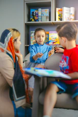 Children learning with a teacher in a classroom.