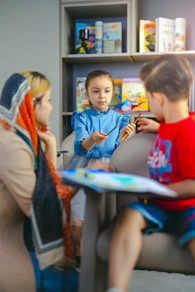 Children learning with a teacher in a classroom.