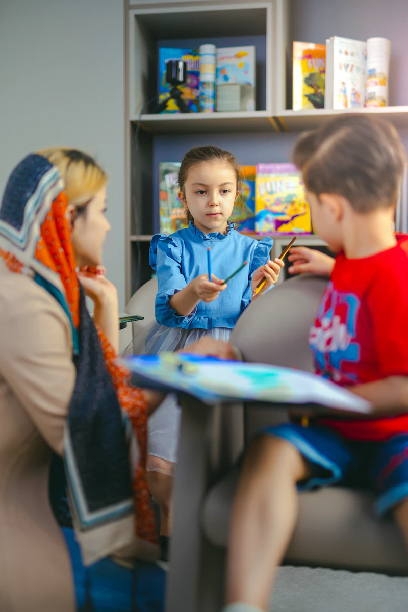 Children learning with a teacher in a classroom at P.A.T.H.