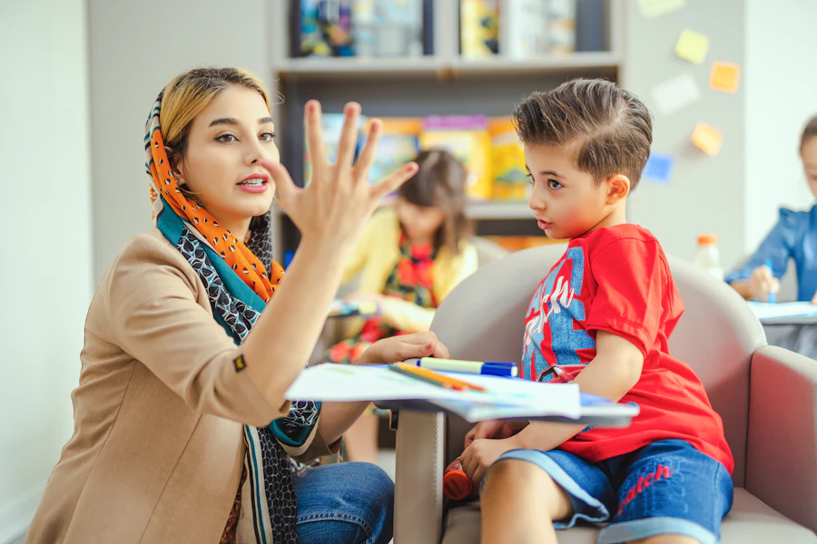 Speech therapist playing a table activity with a child