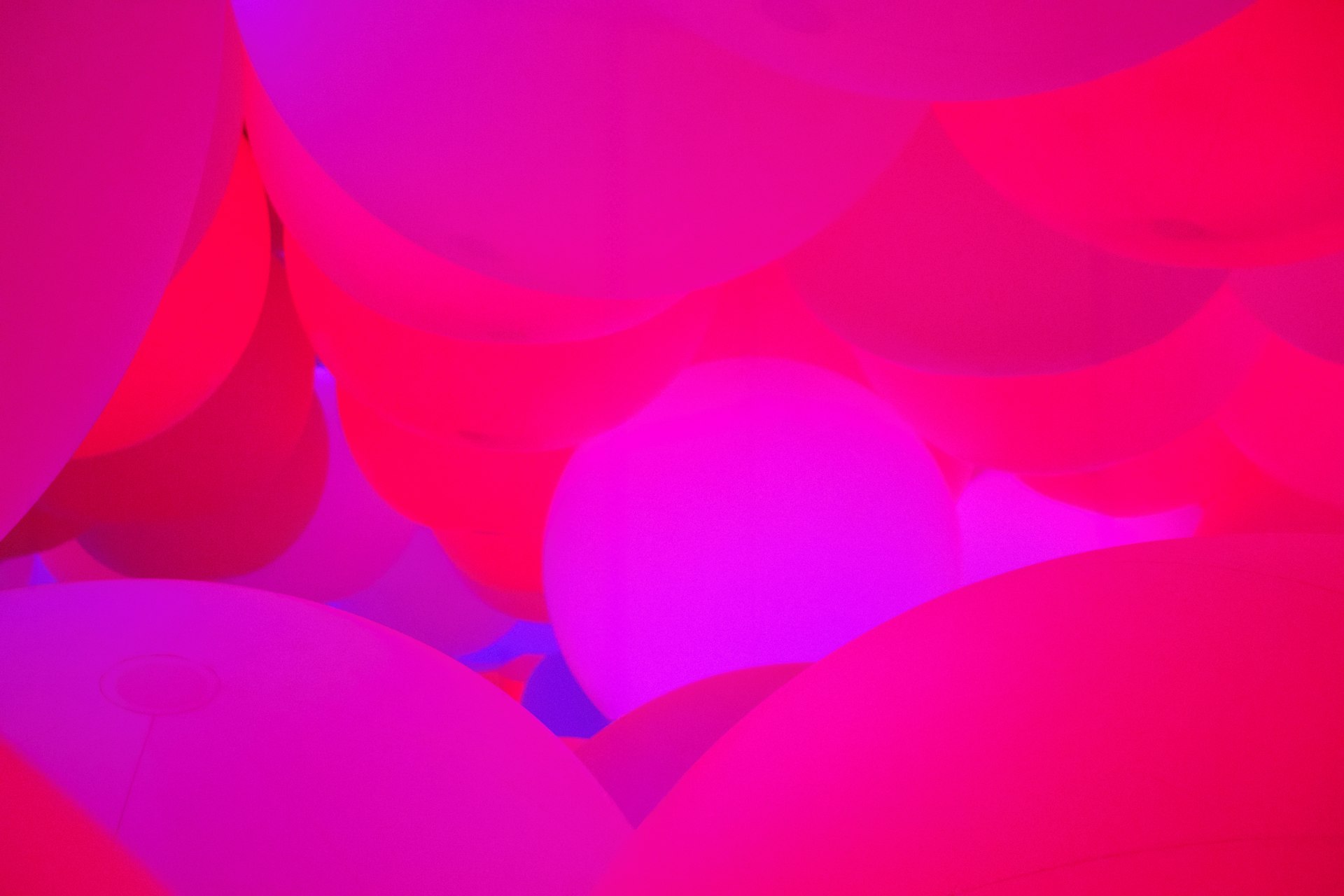 Abstract pink and purple glowing spheres.