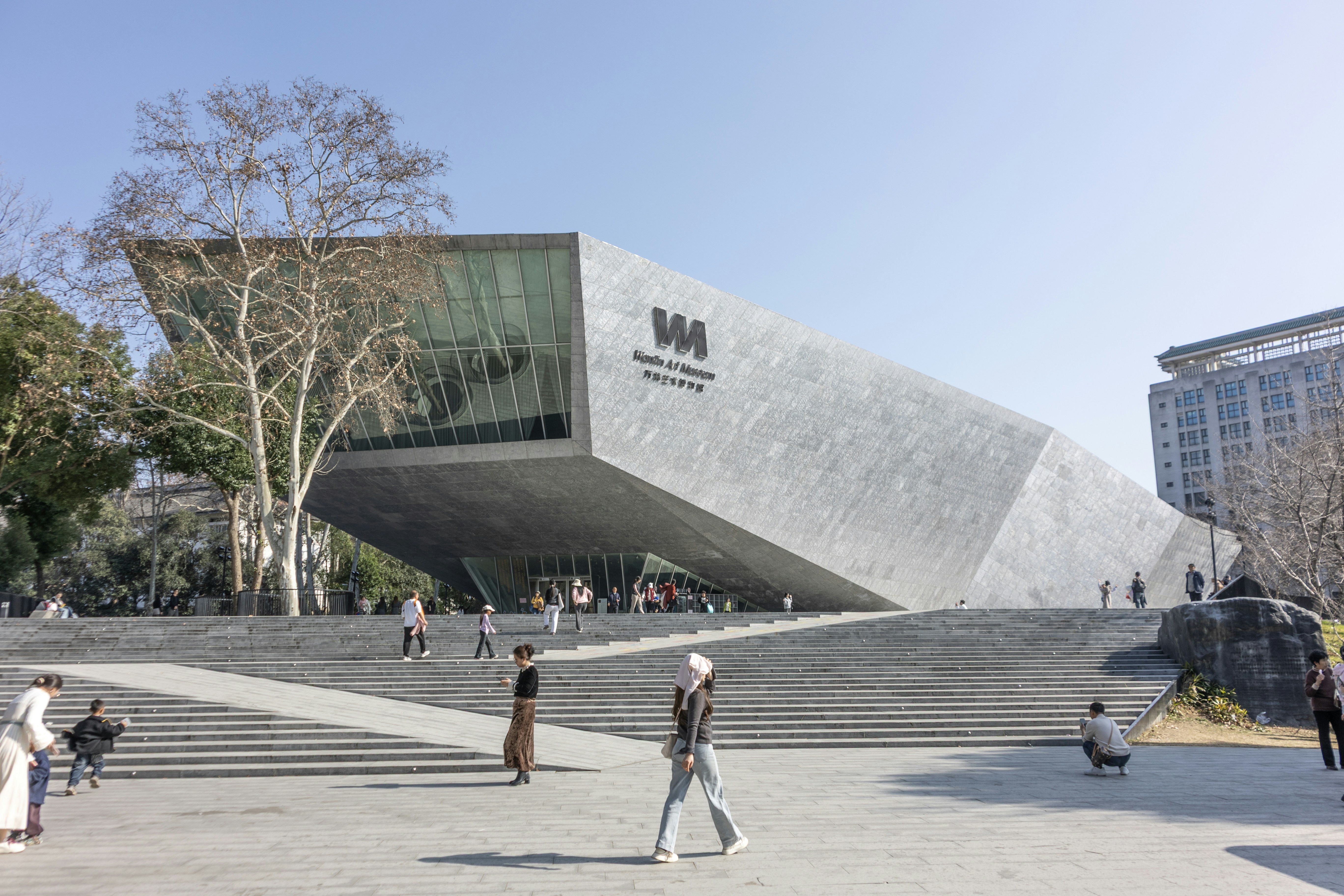 Modern concrete building with large glass windows