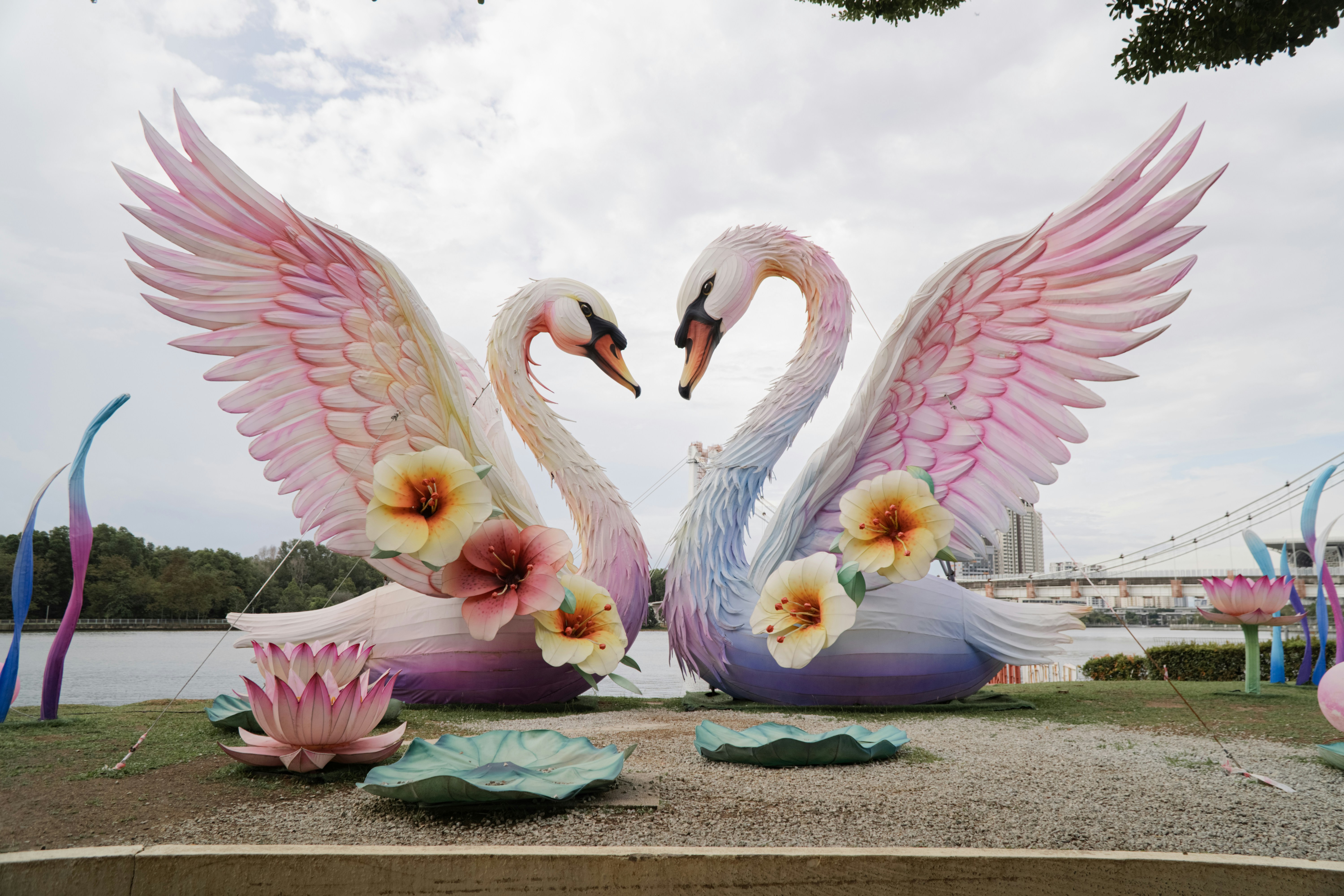 Two swan sculptures forming a heart shape