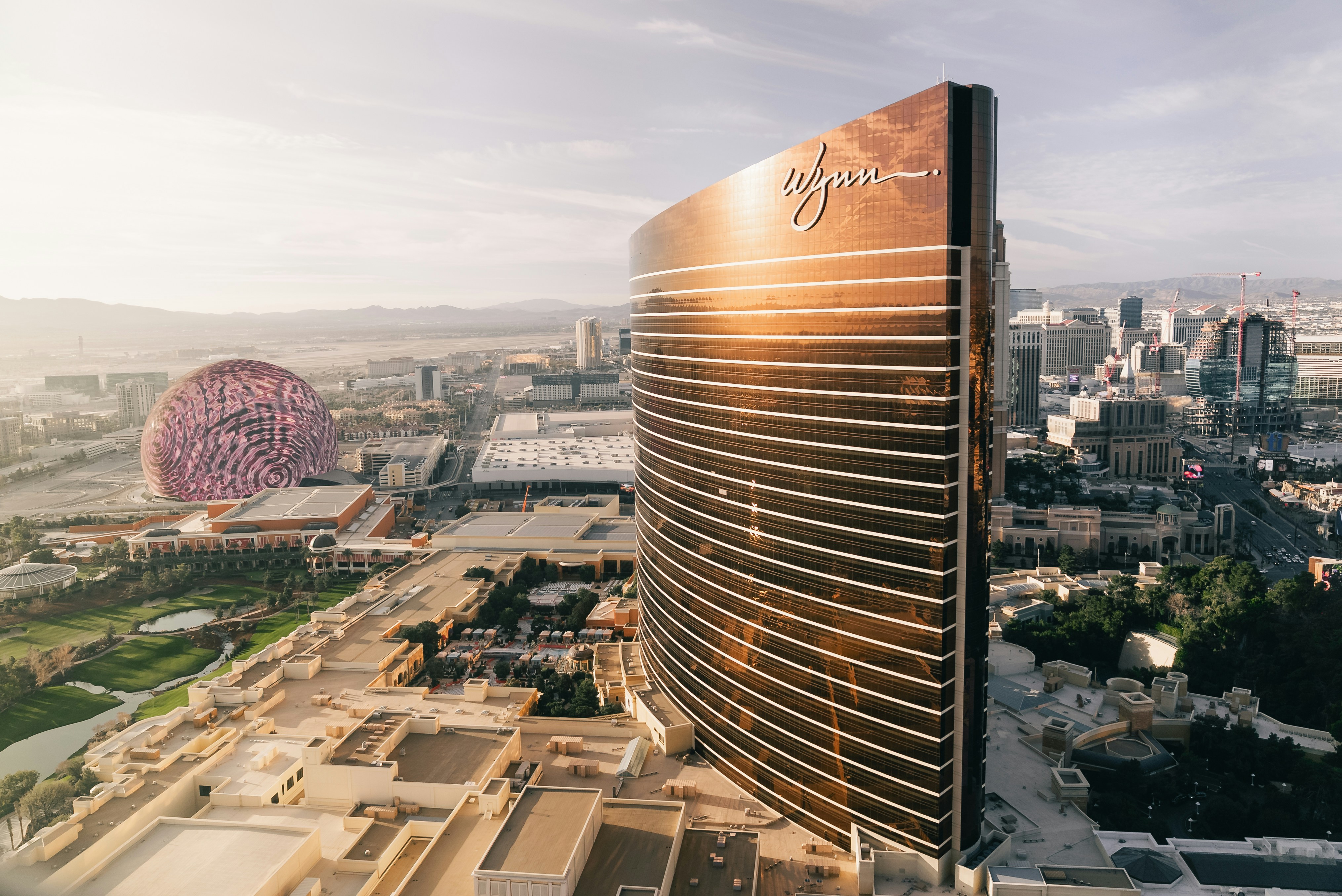 Modern skyscraper and ferris wheel in a city