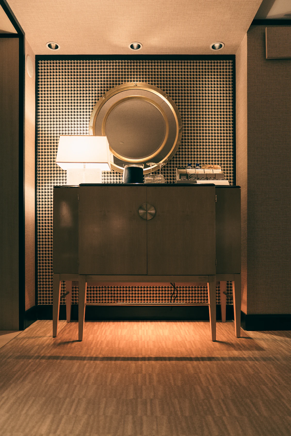 Considered interior detail with mirror and lamp