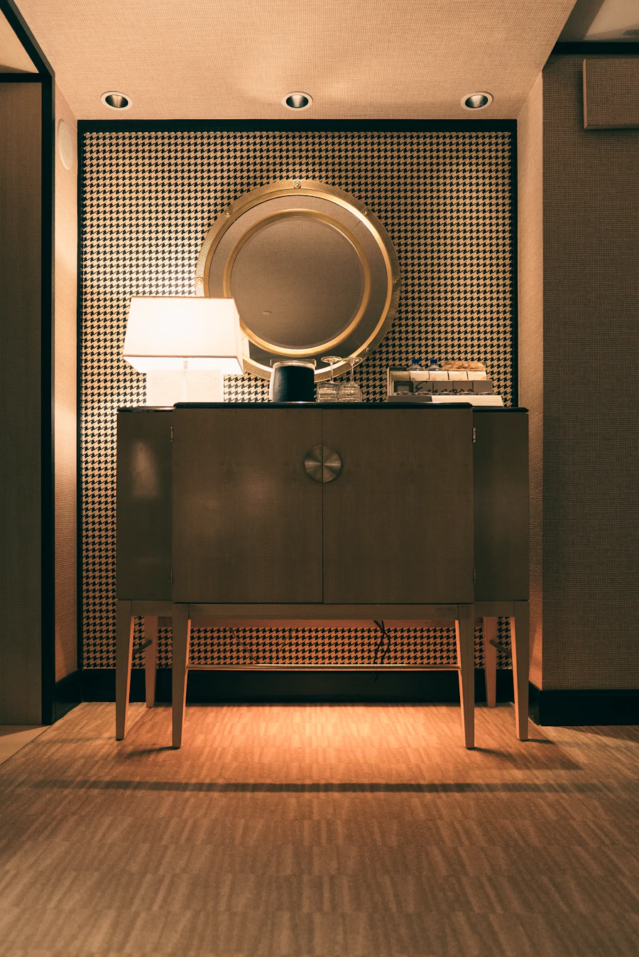 Considered interior detail with mirror and lamp