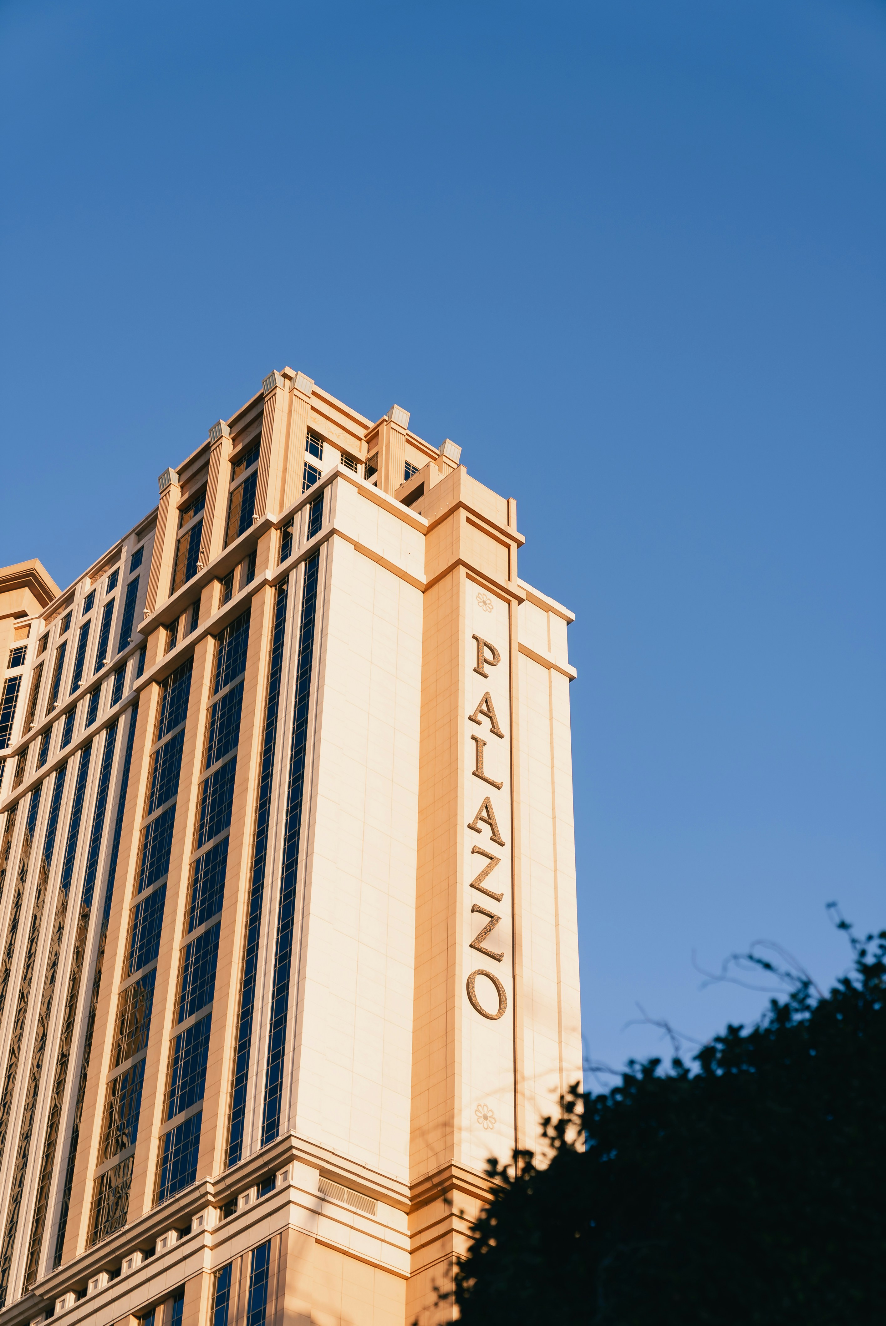 Tall building with palazzo written on side photo – Free Architecture ...