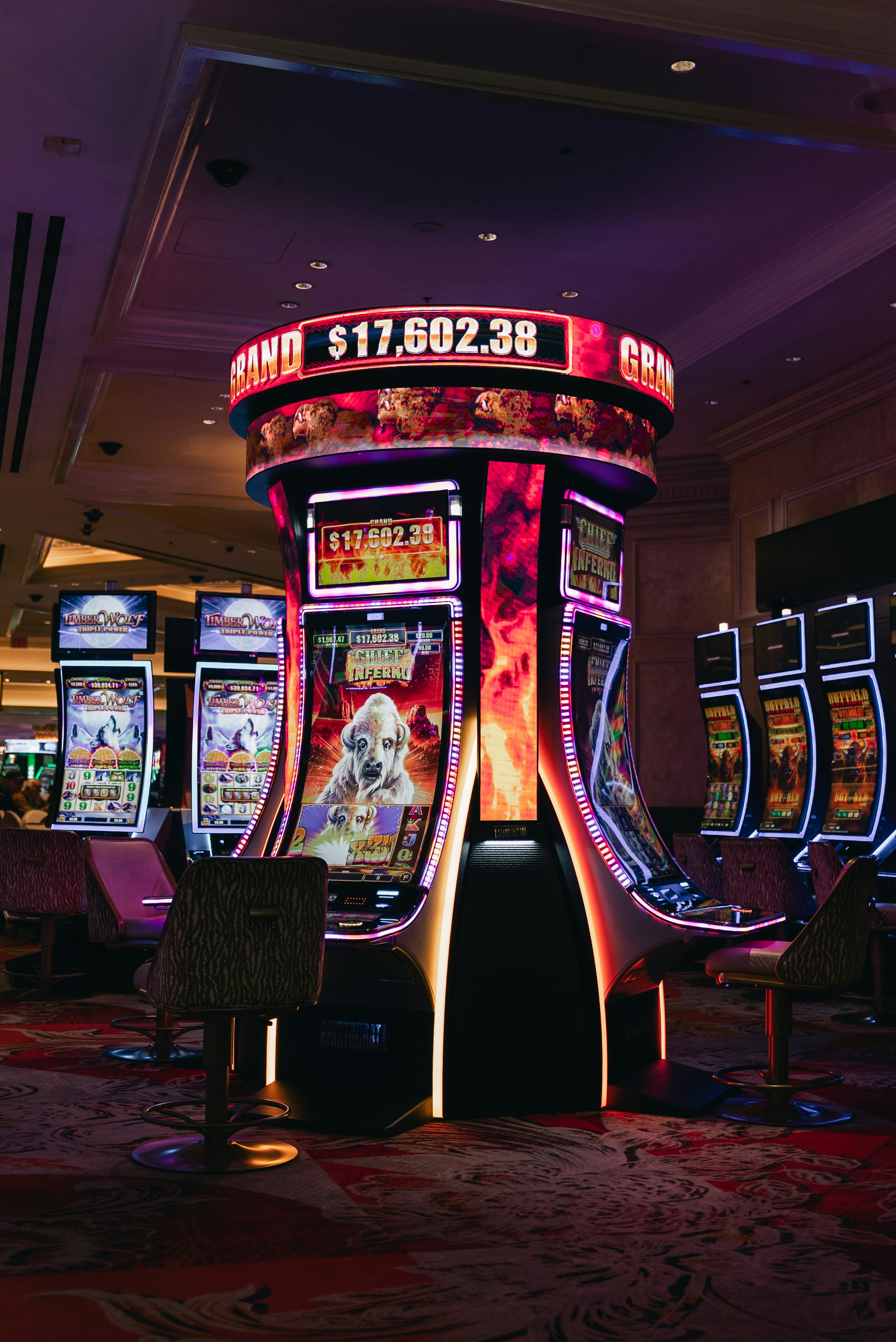 Slot machines with glowing lights and jackpot display