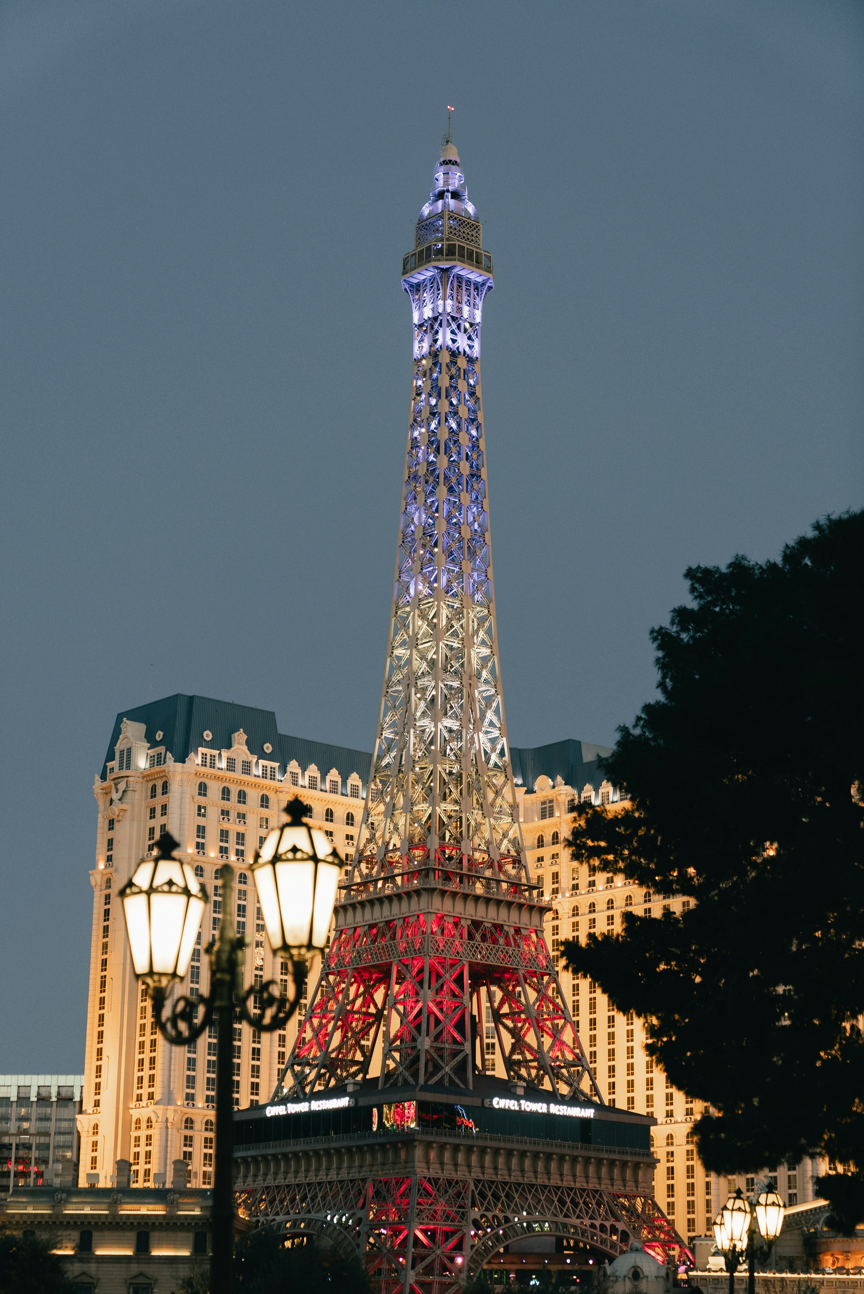 Eiffel tower replica illuminated with red, white, and blue lights