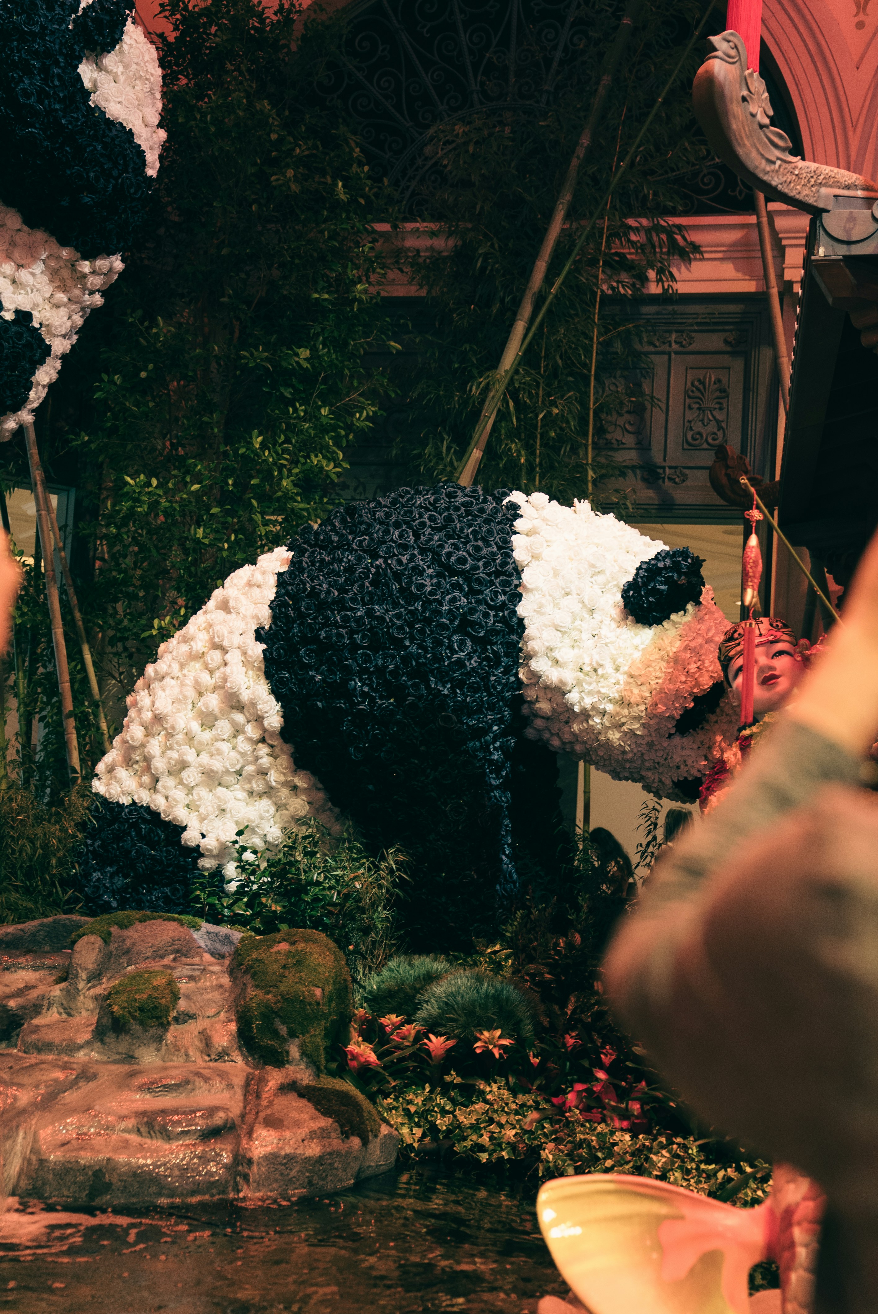 Giant panda sculpture made of flowers and foliage
