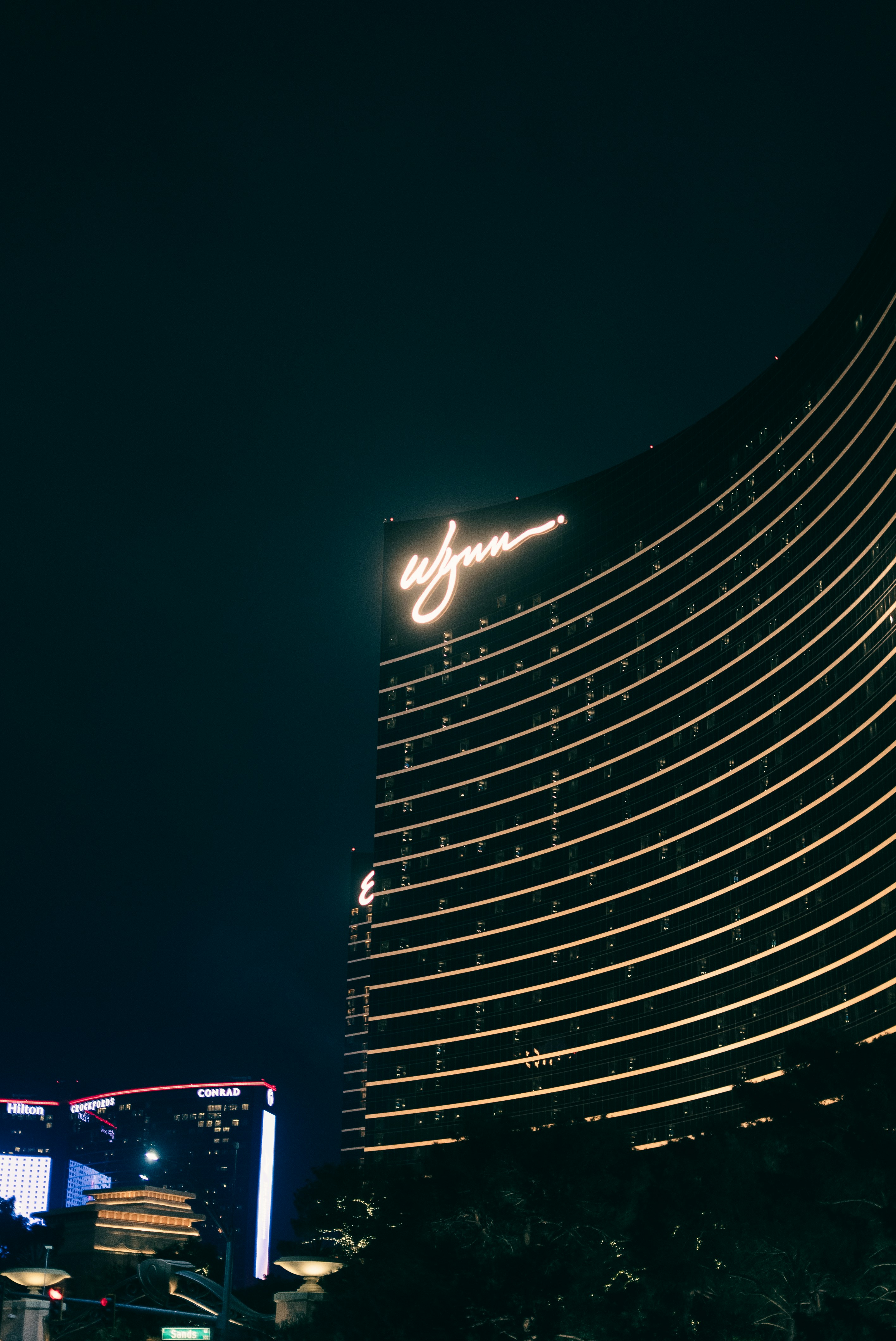 Modern skyscraper with illuminated windows at night