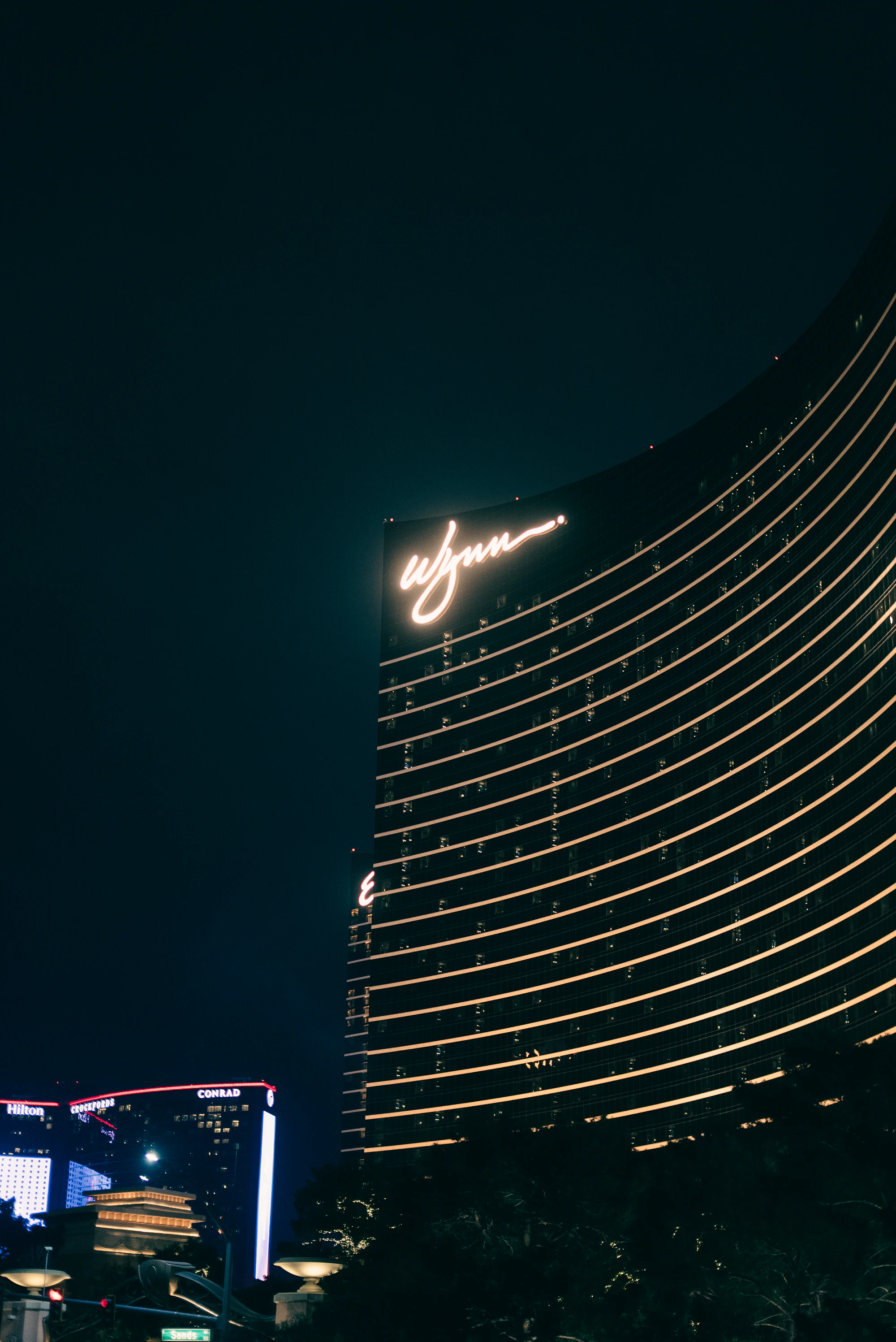Holdem House casino hotel tower illuminated at night