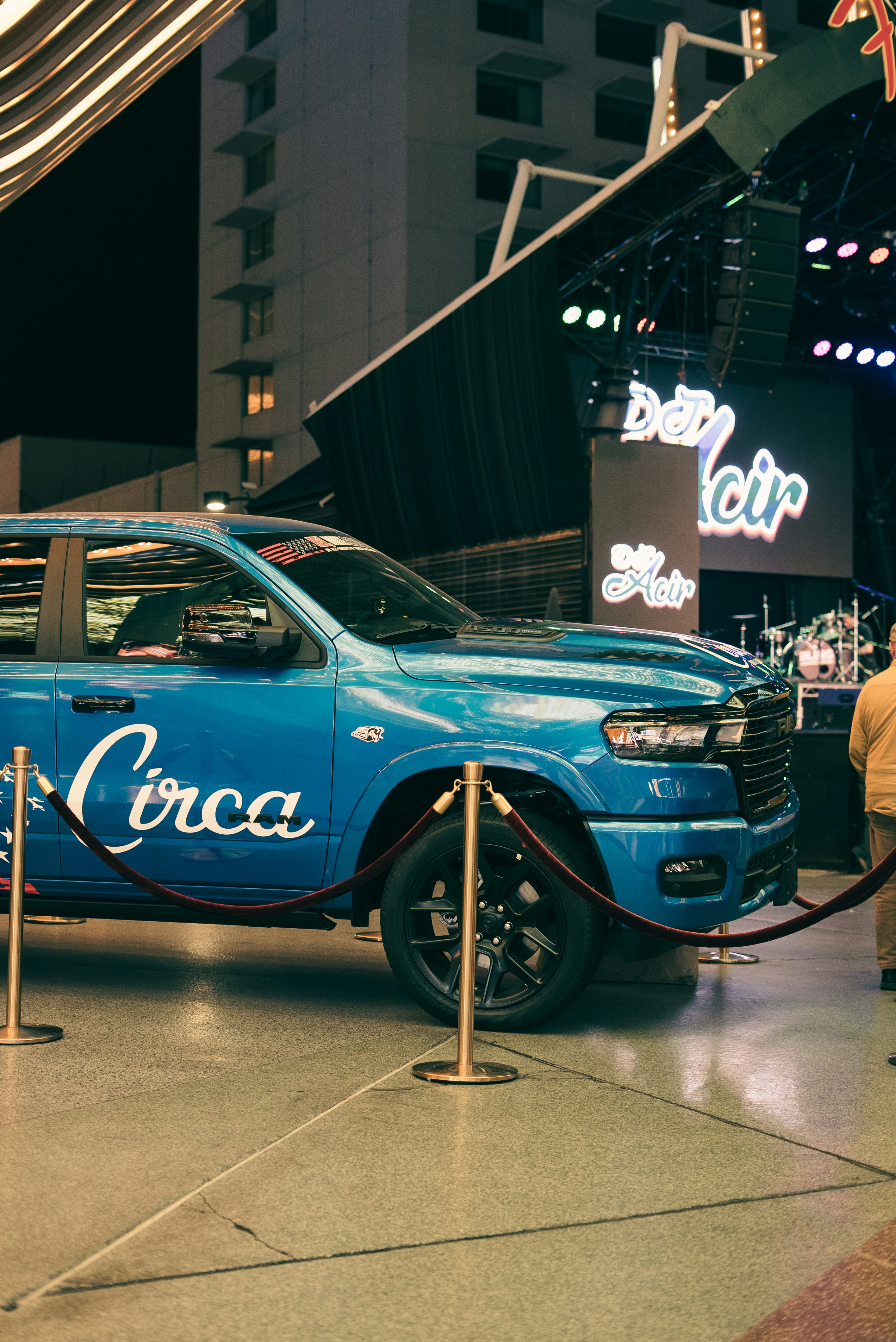 Blue pickup truck with "circa" logo at night