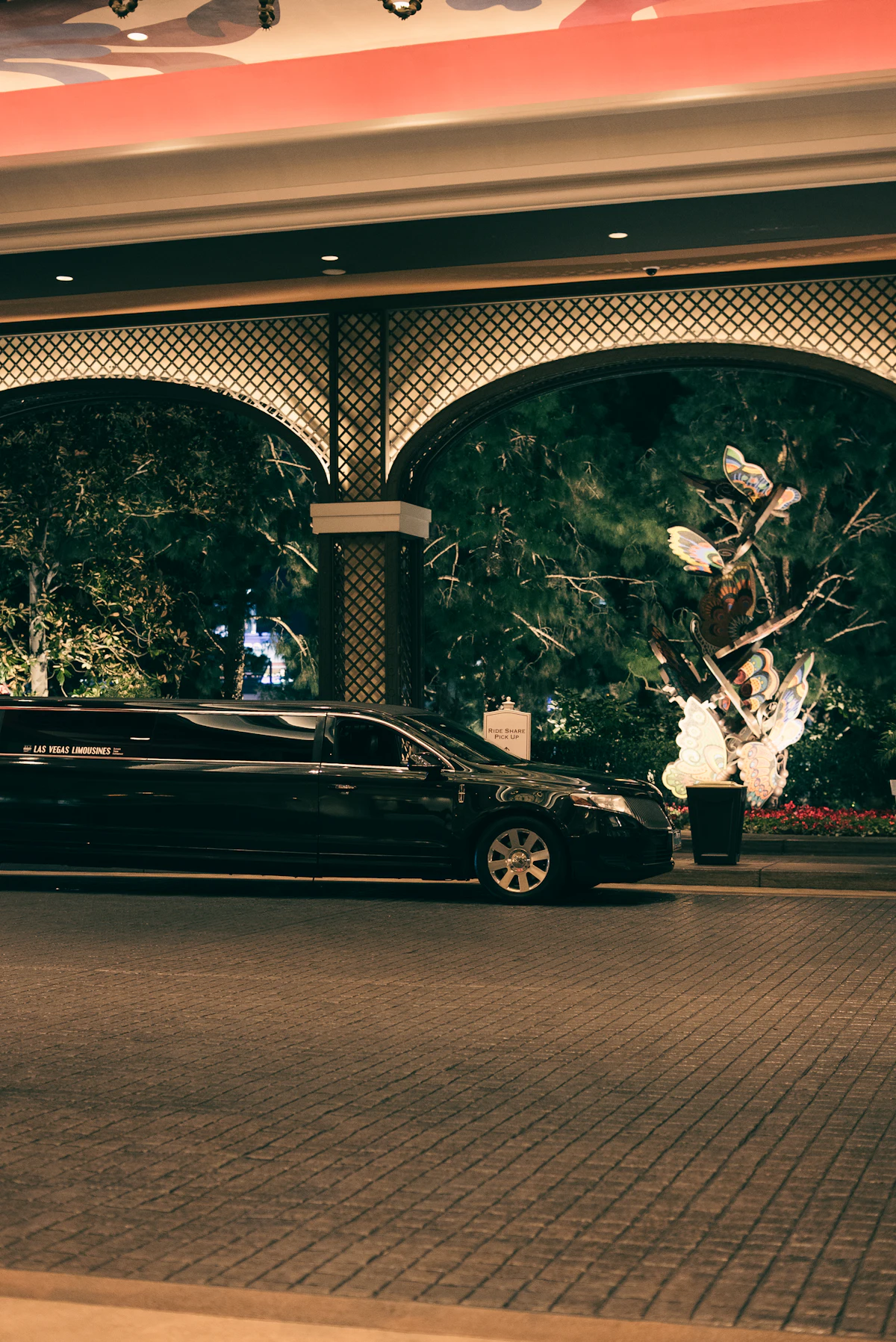Black chauffeur car outside a London building