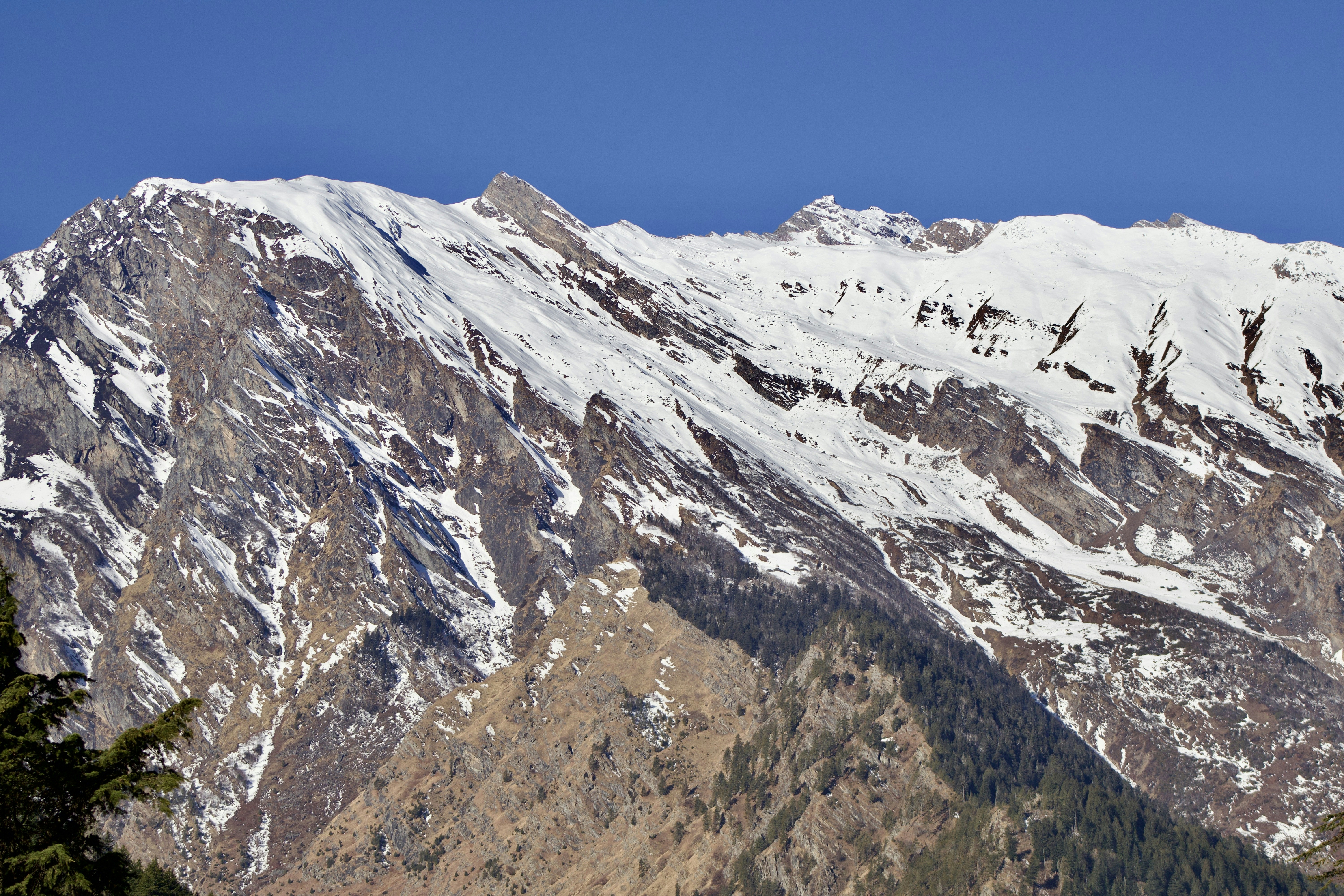 Snow-capped mountains under a clear blue sky.