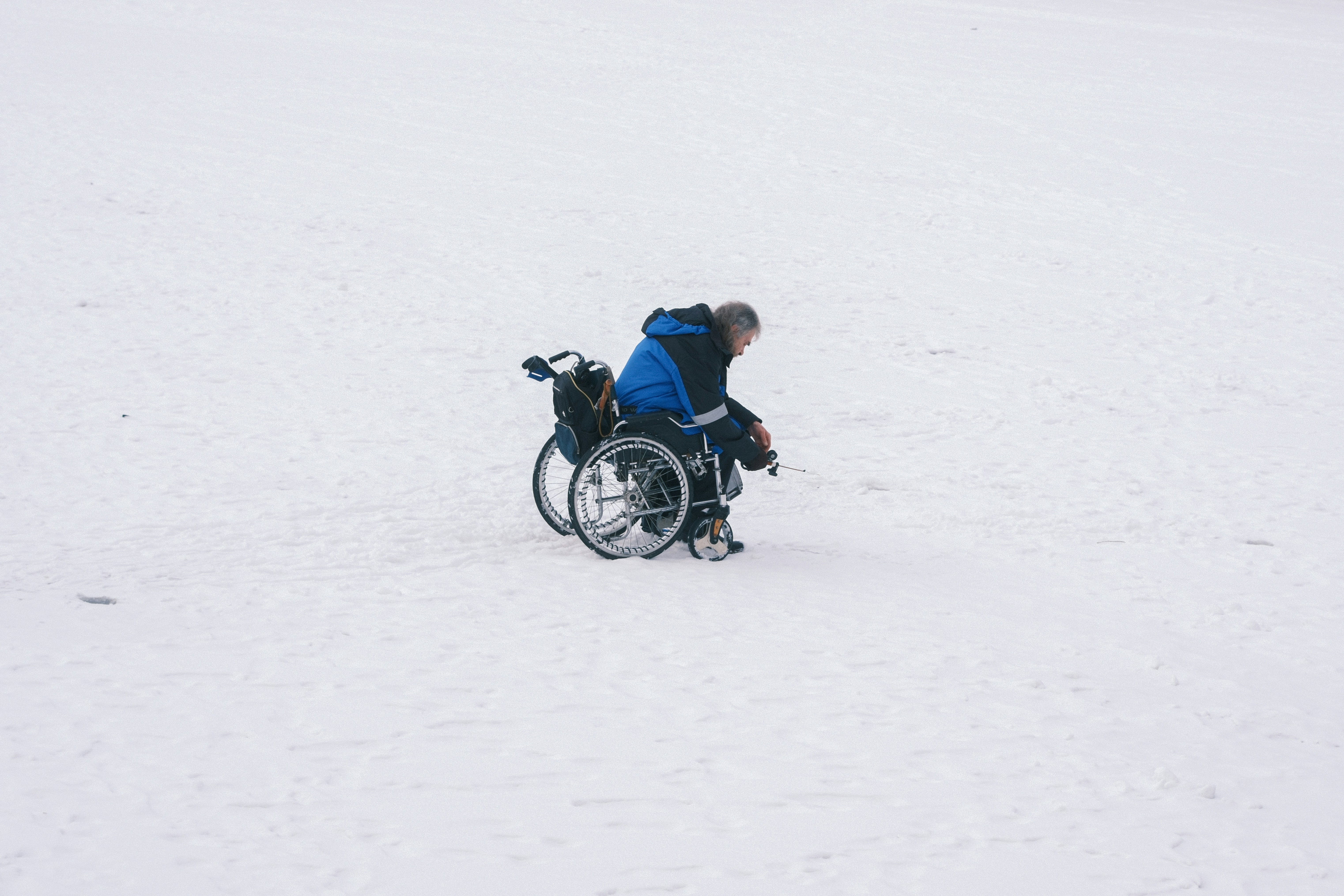 Person in wheelchair on a snowy field