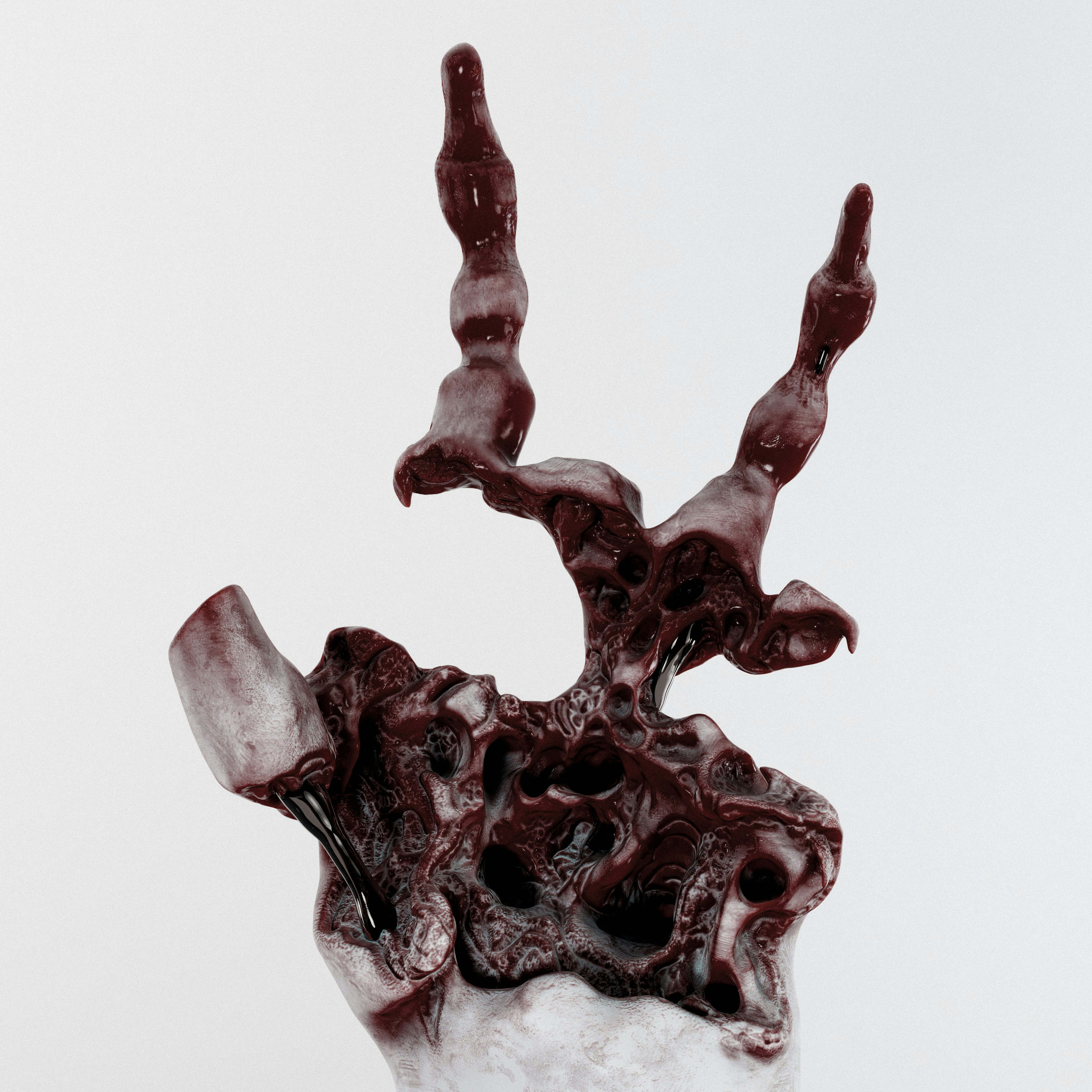 Una scultura scura e astratta con forme organiche e fluide.