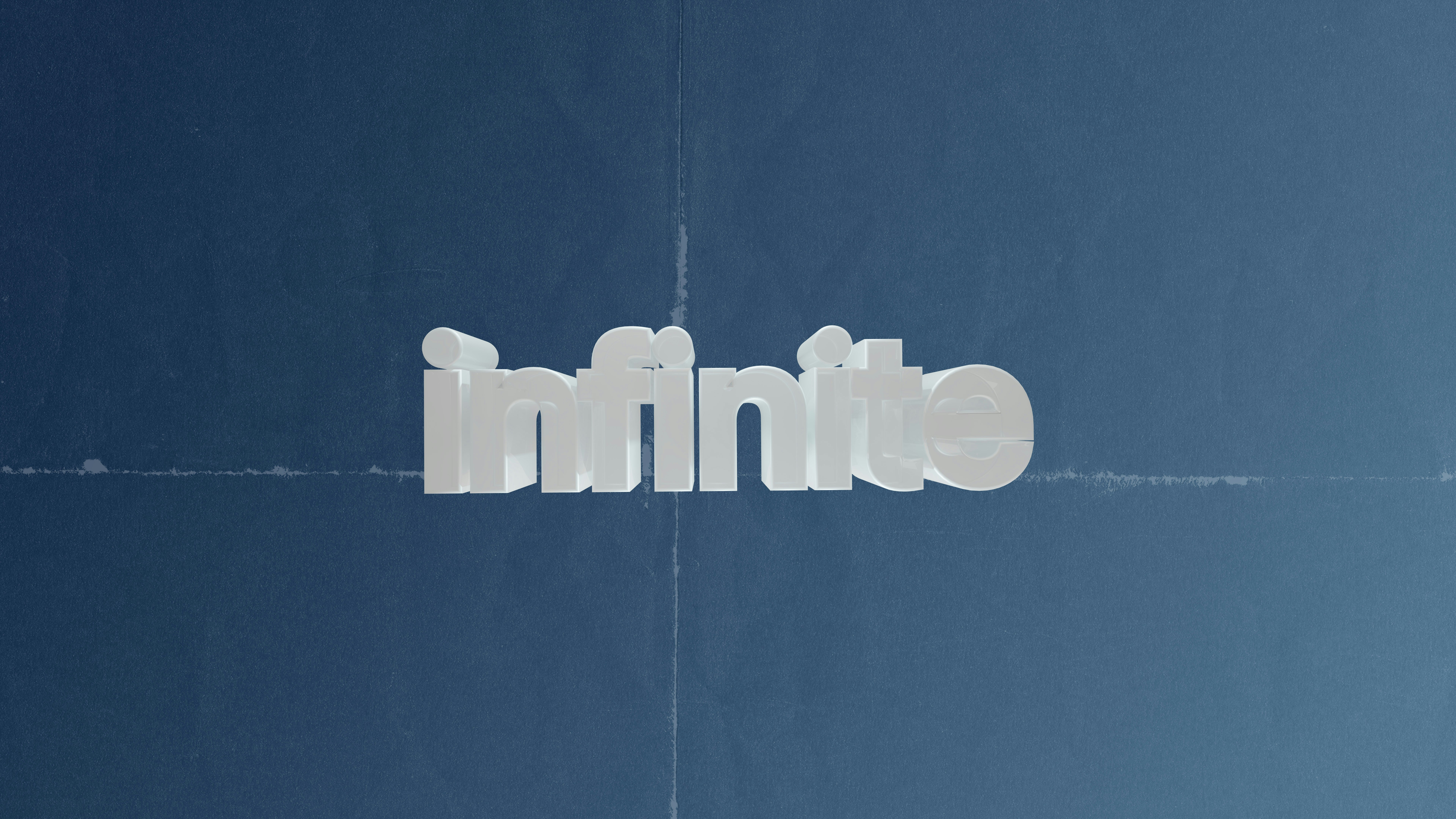 The word infinito in white 3D letters
