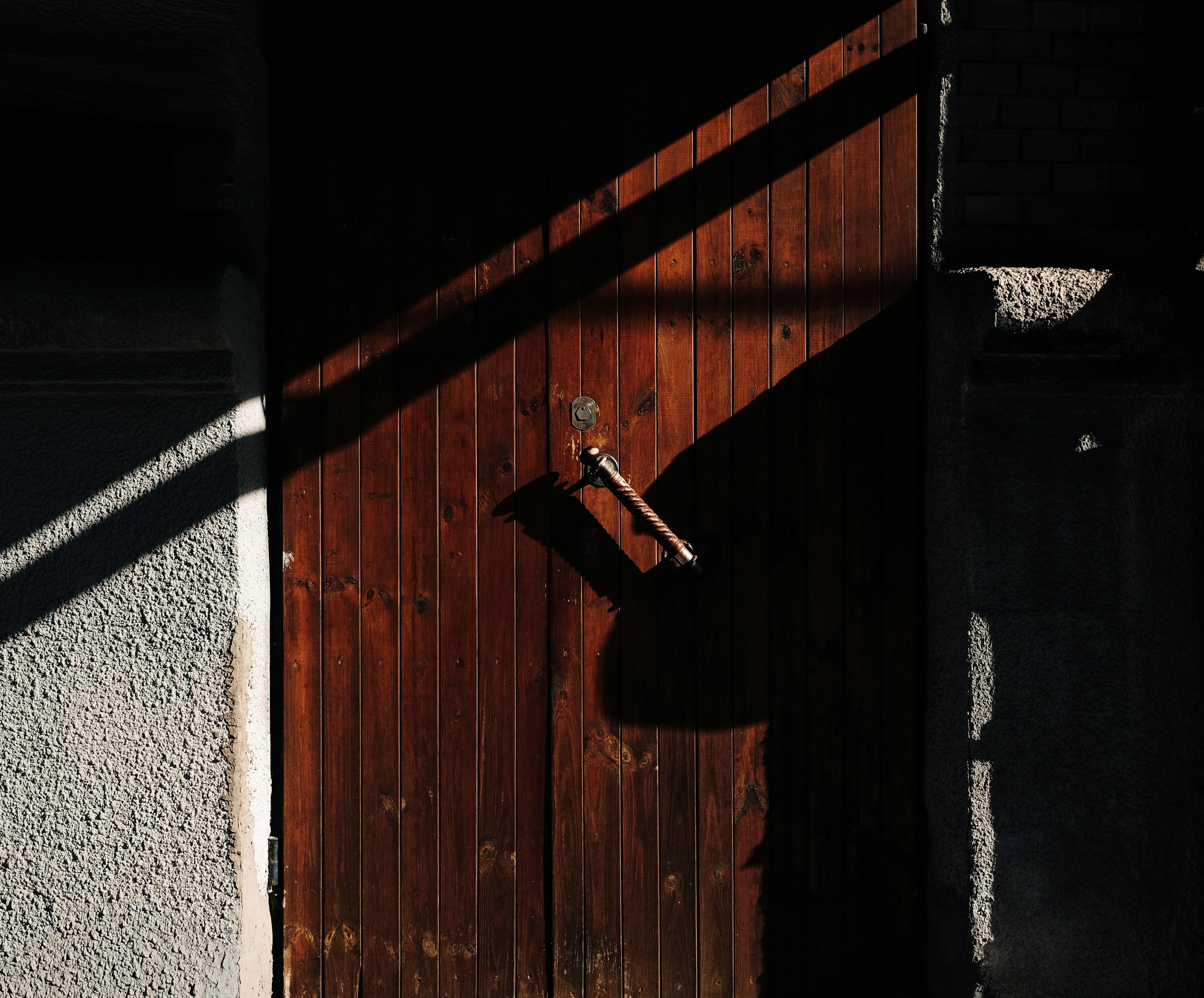A person installing a door with incorrect measurements and tools.