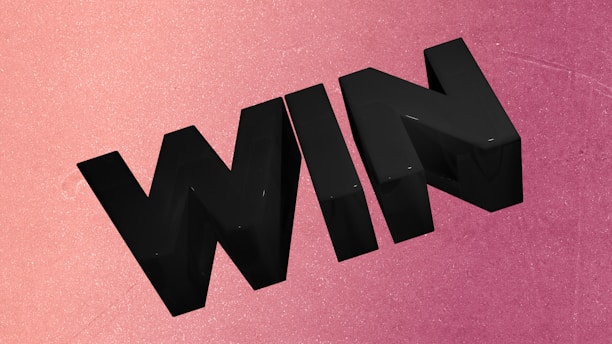Black 3D word win on pink background