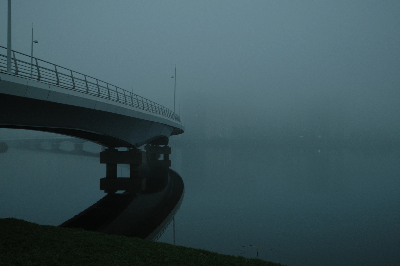 Modern bridge disappearing into fog, representing succession and uncertain authority