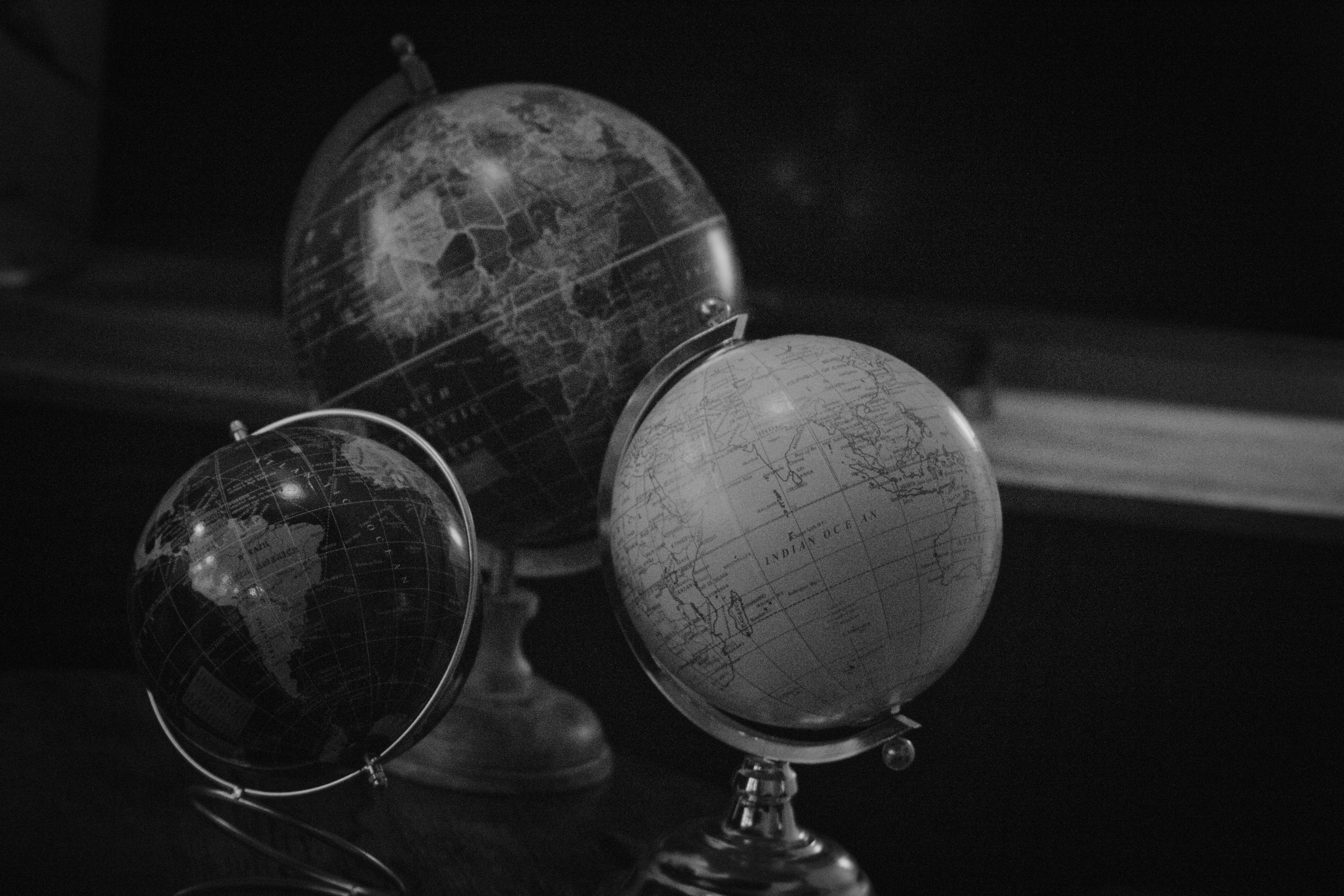 Three globes on a dark background
