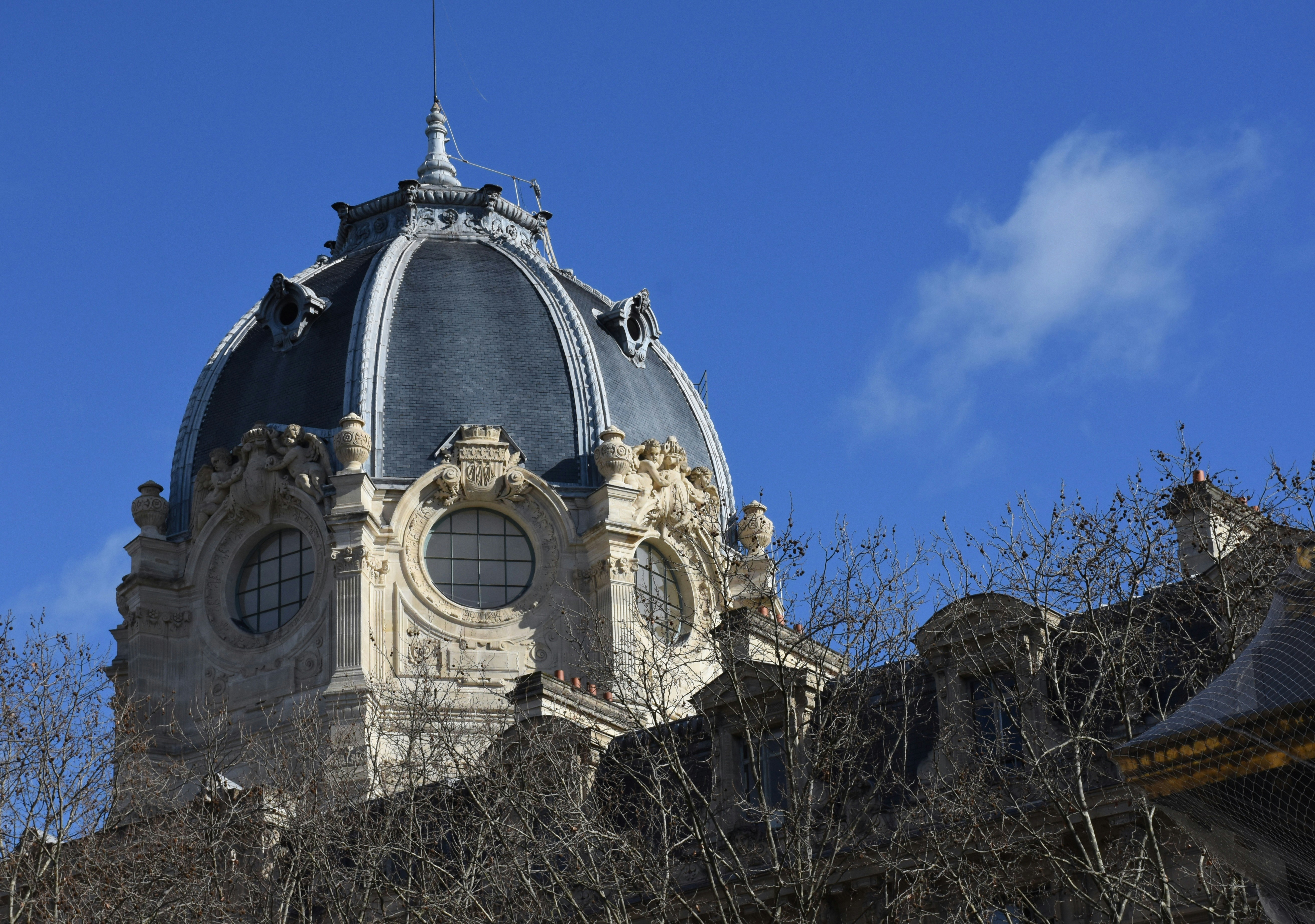 Ornate dome building against a clear blue sky.