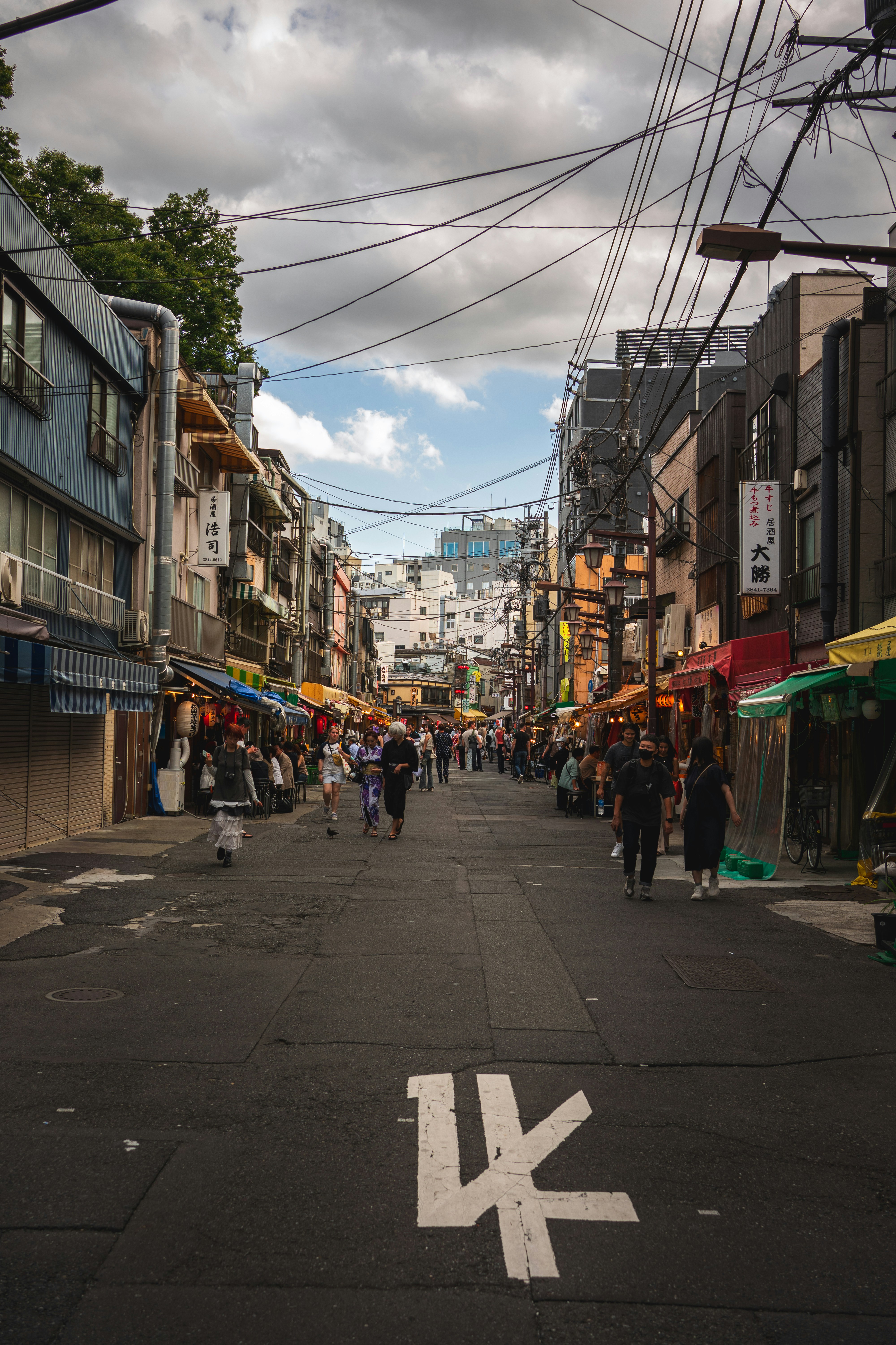 Bustling street market with stalls and people