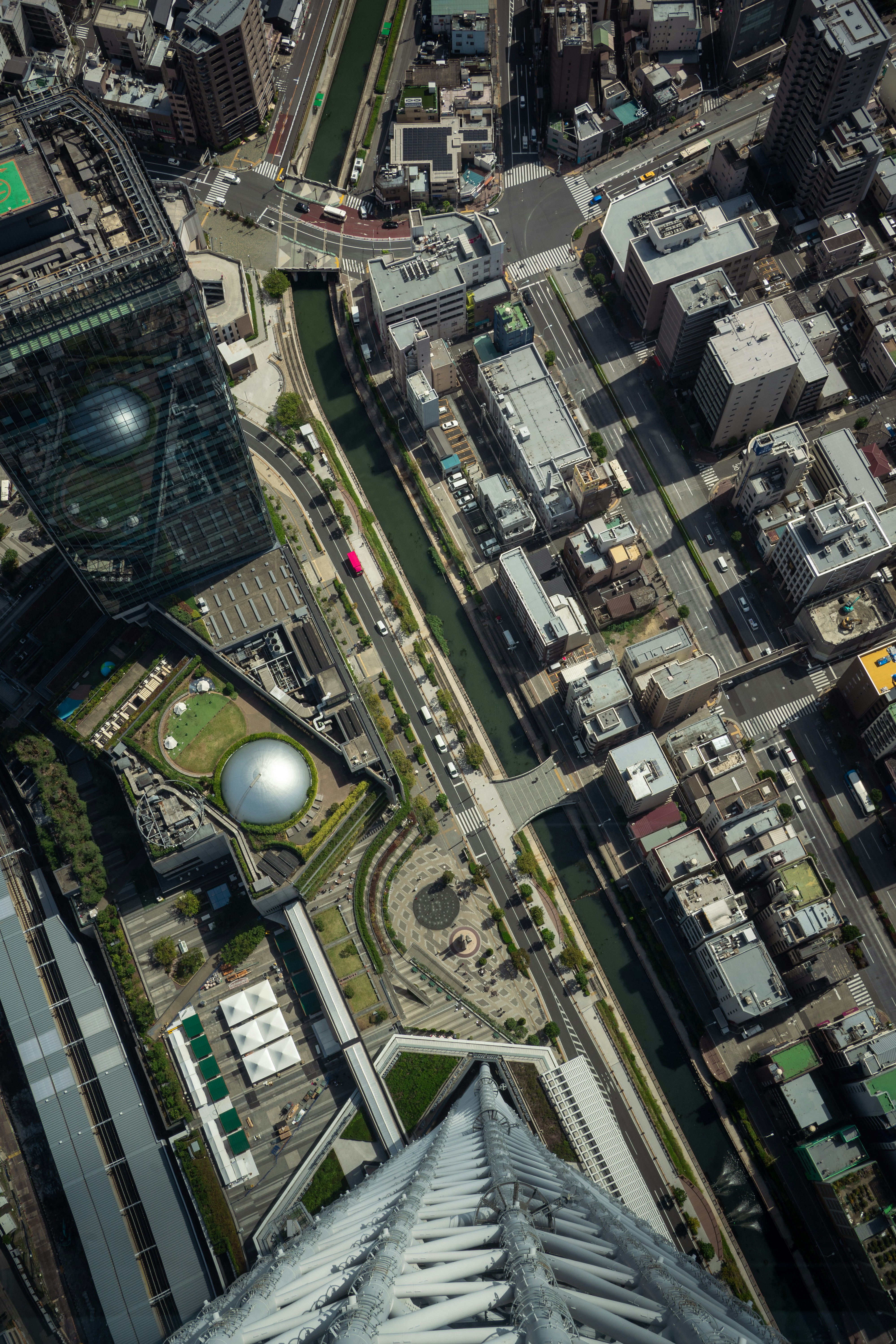 Aerial view of a city with a river and buildings