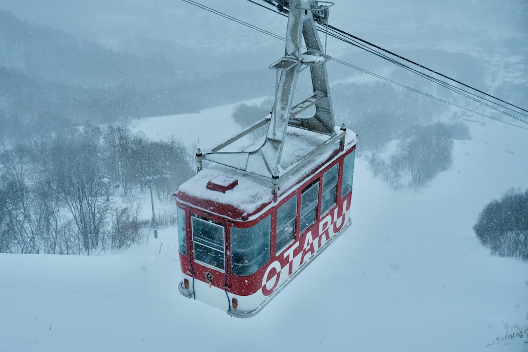 Scenic cable car ascending through mountain landscape, representing the transportation infrastructure that makes multi-day Zhangjiajie exploration feasible