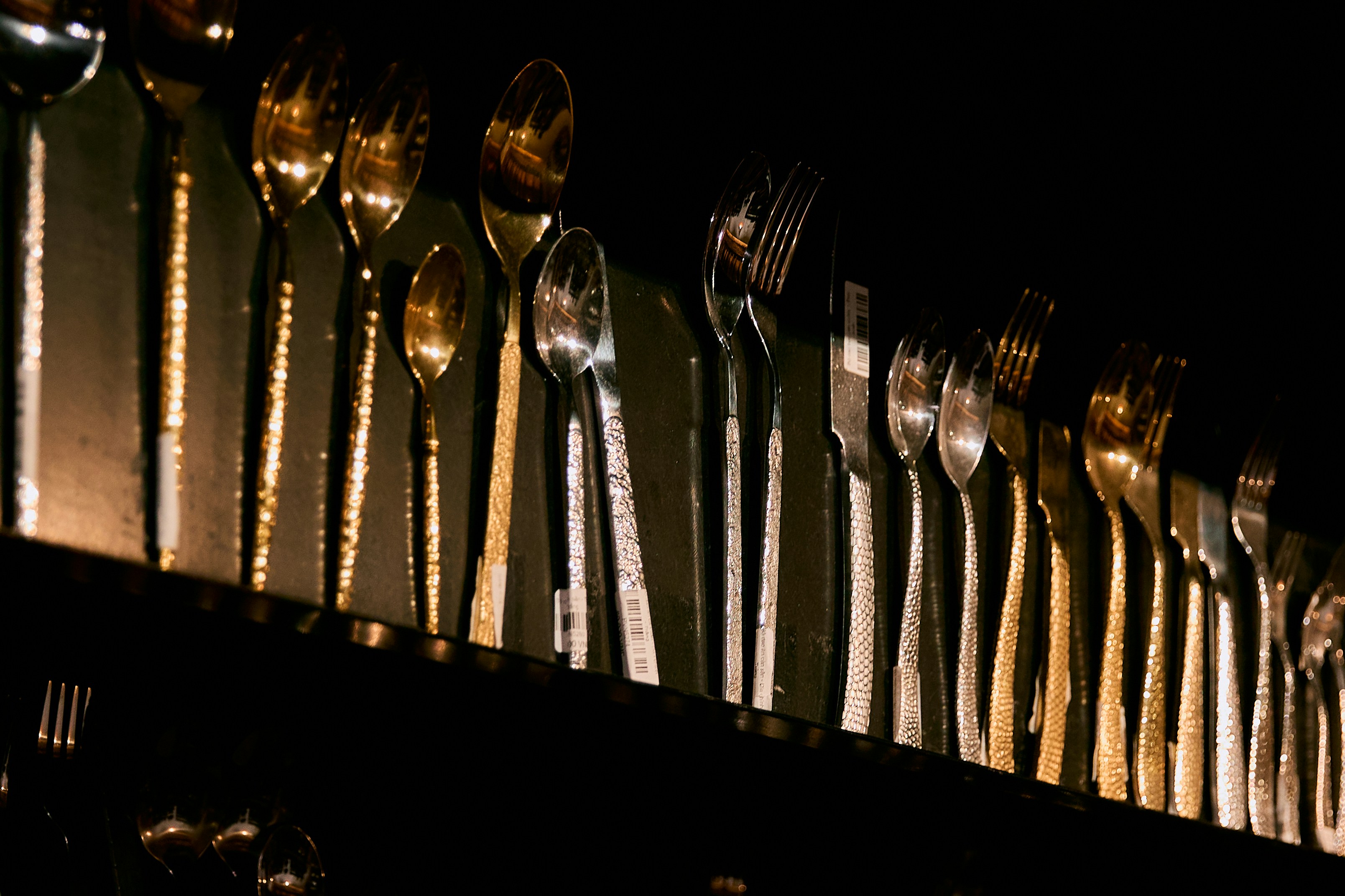 A collection of silverware and cutlery arranged neatly.