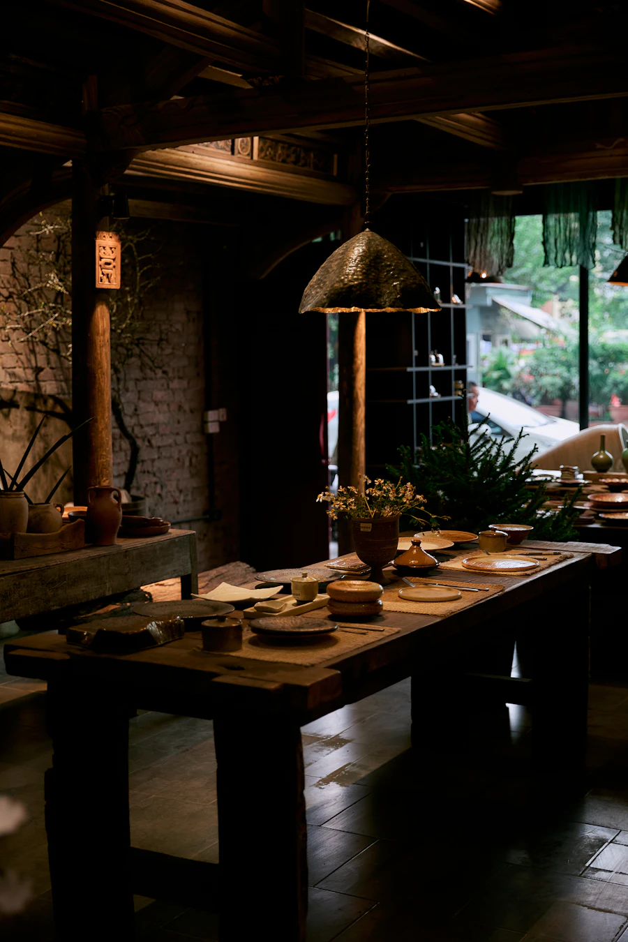 A rustic wooden dining table set for a meal
