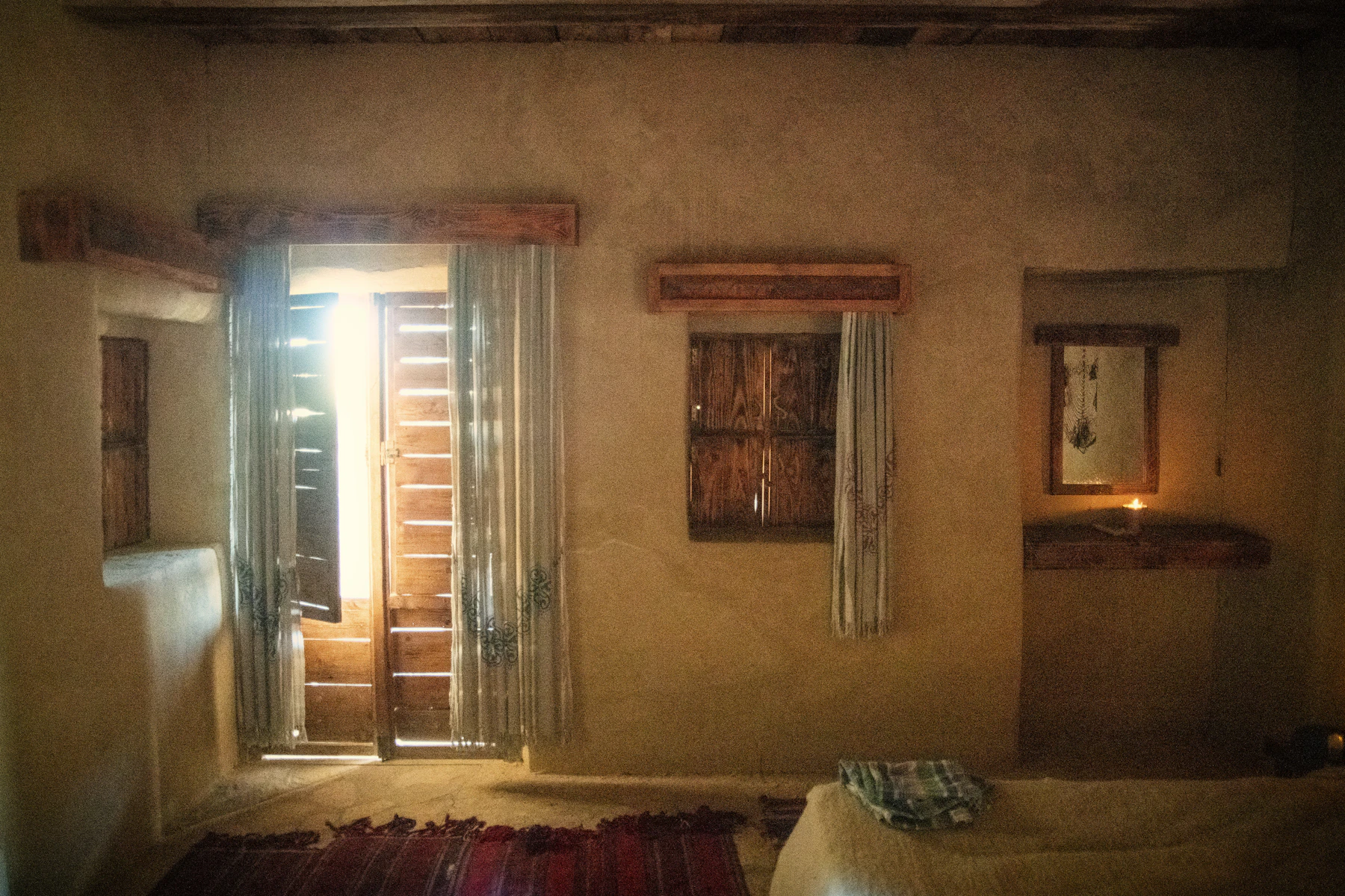 Warm rustic interior with earthen walls and natural materials