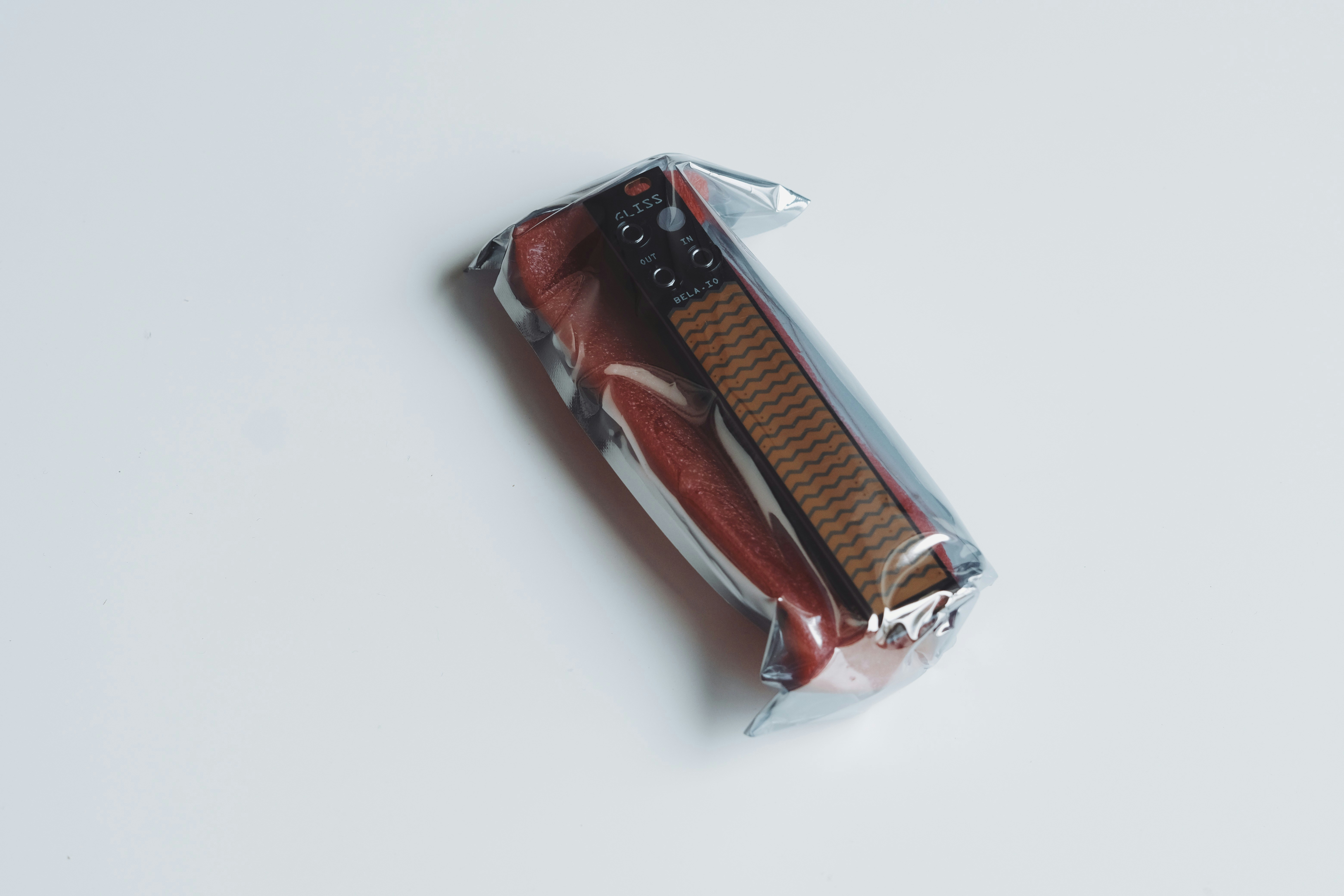 A chocolate wafer cookie wrapped in plastic