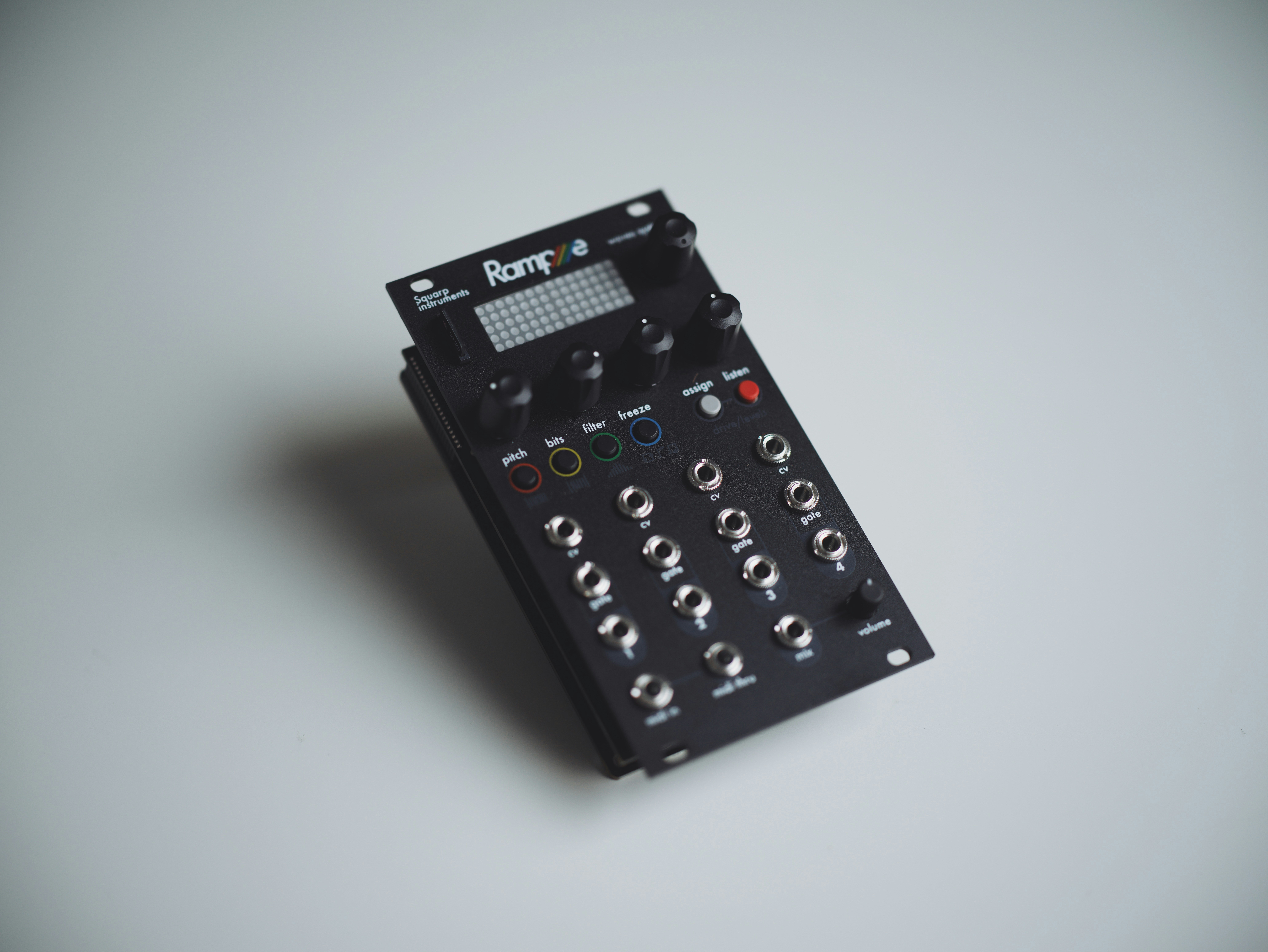 Black electronic music synthesizer with knobs and jacks