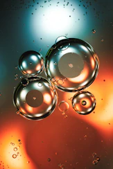 Macro view of oil and water bubbles with colorful reflections