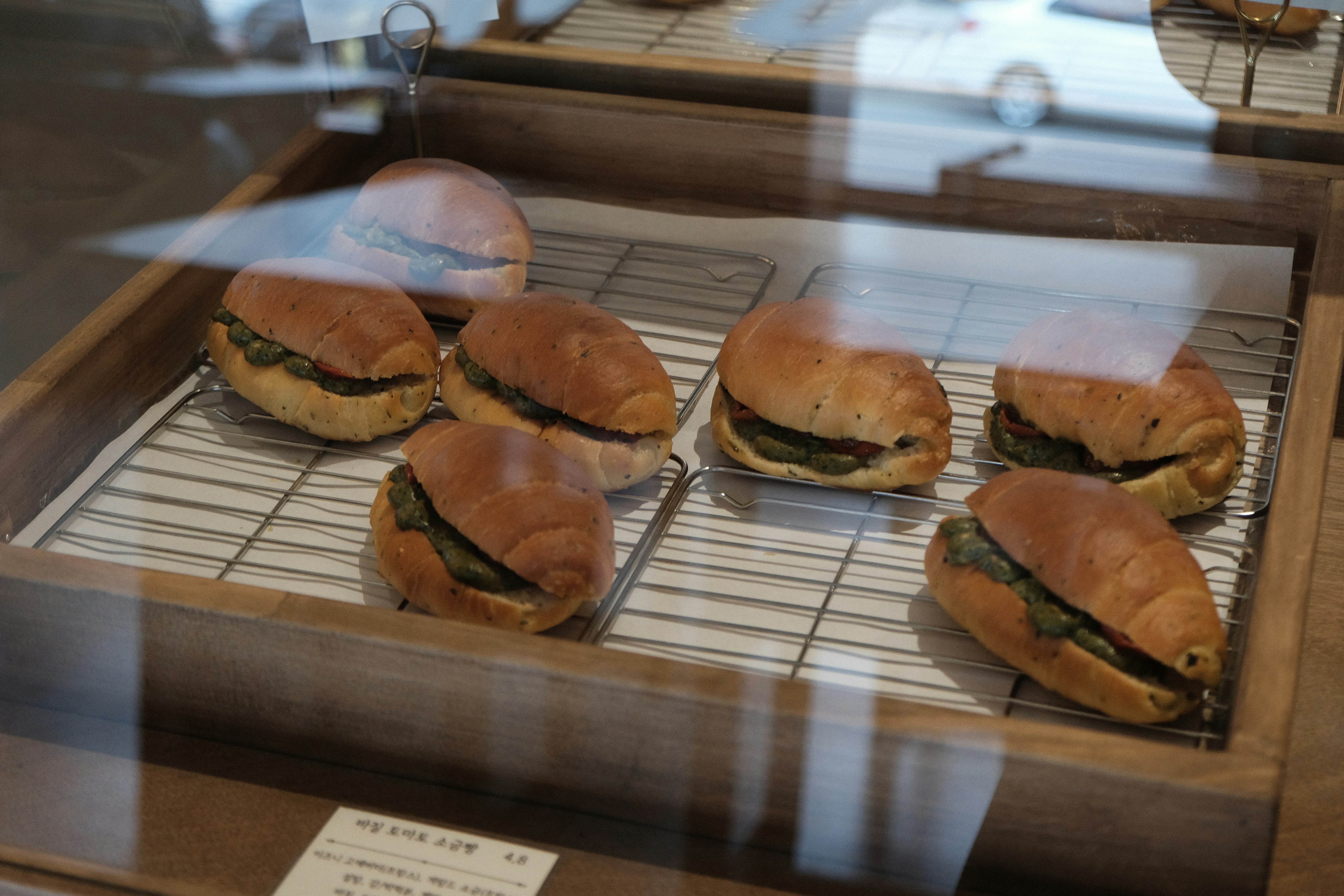 Several sandwiches in a wooden tray