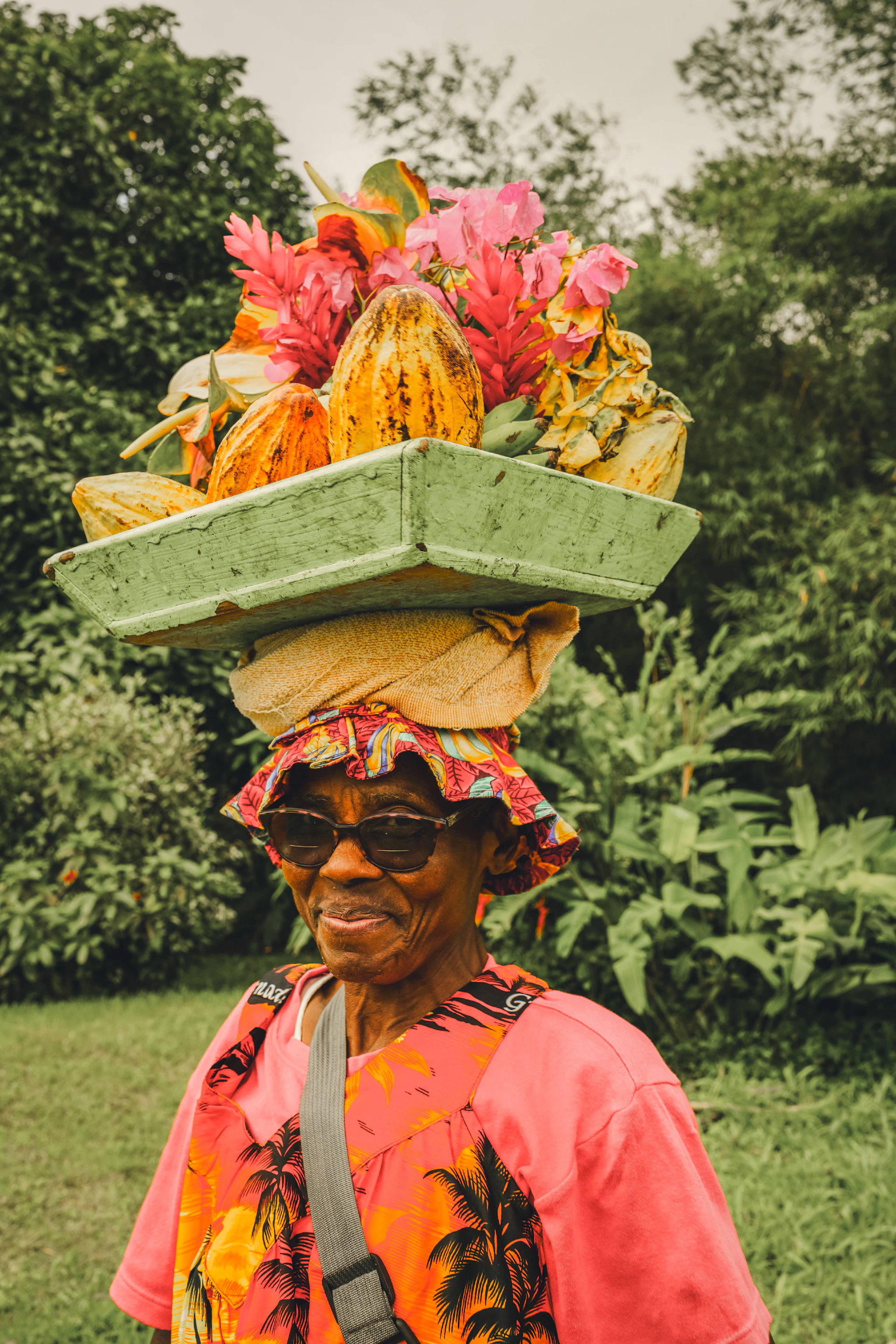 Woman with fruit and flowers on her head