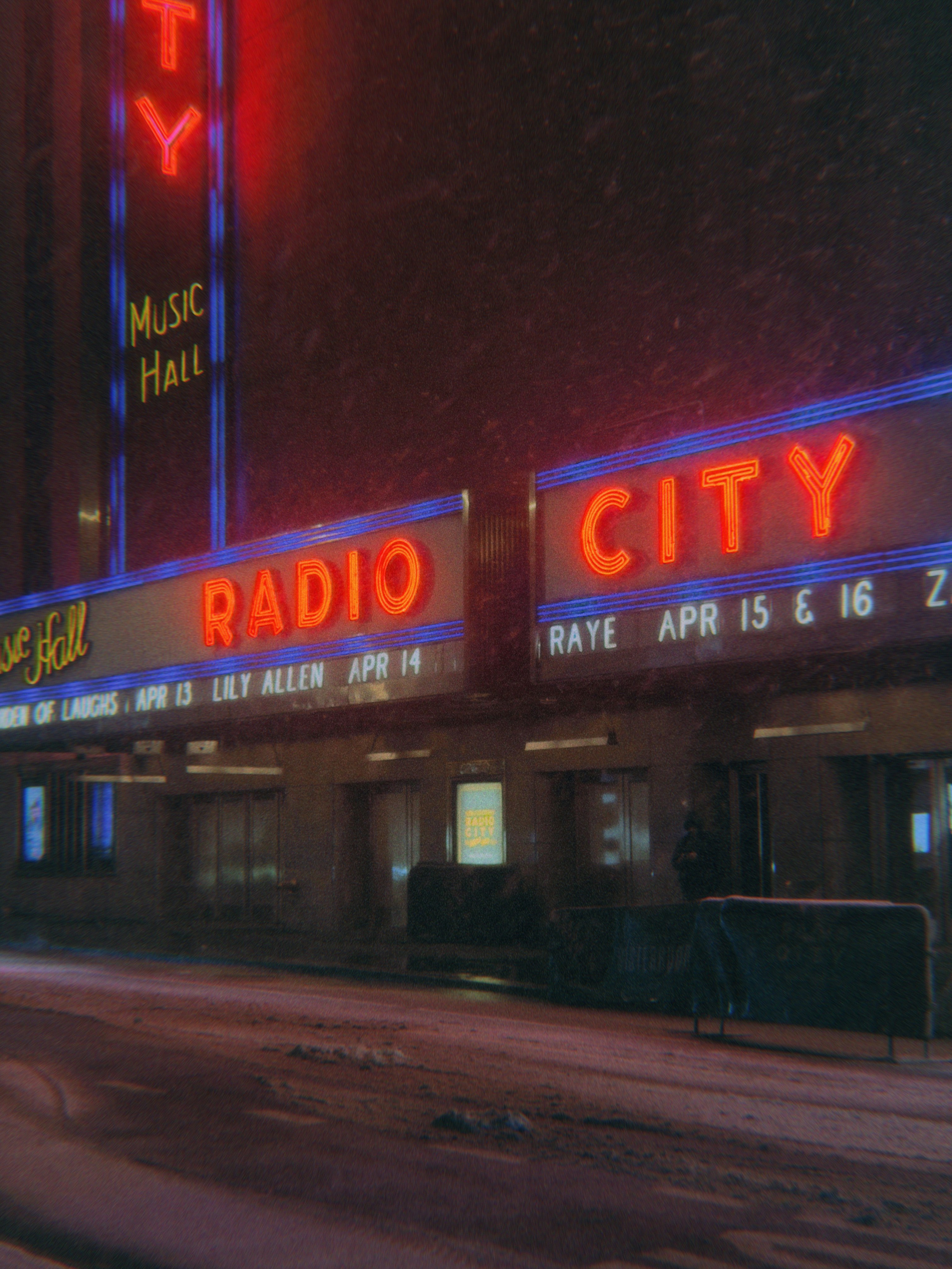 Radio city music hall at night with snow falling