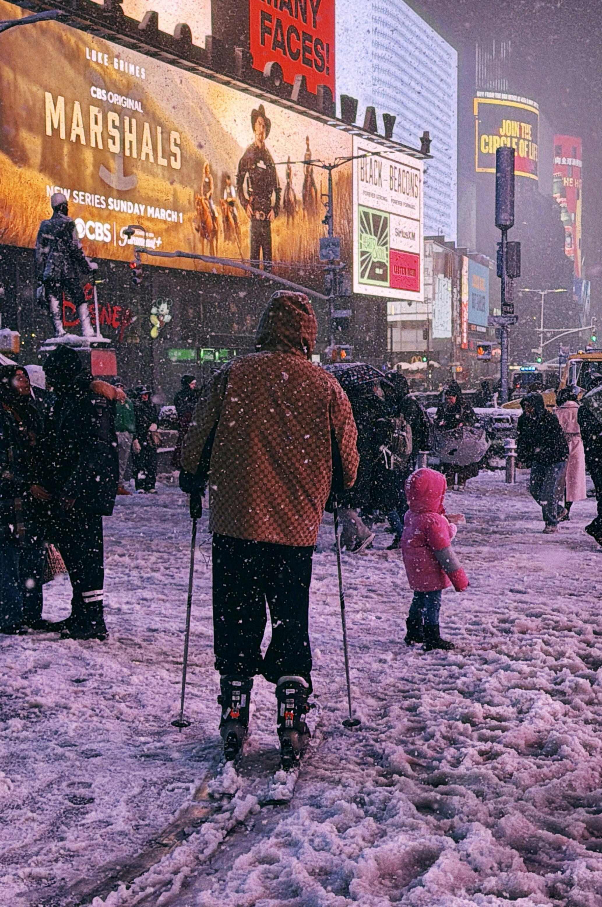People skiing in times square during a snowstorm.