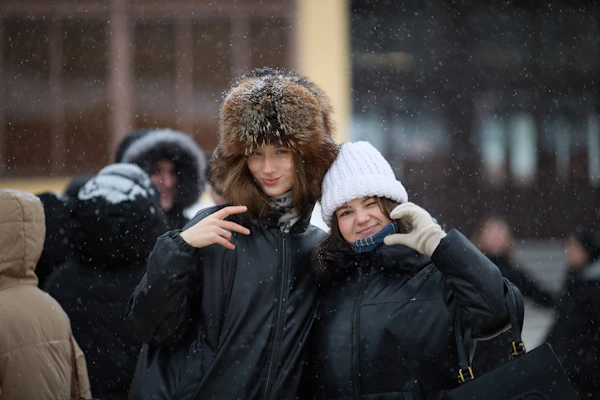 Two people embracing warmly outdoors