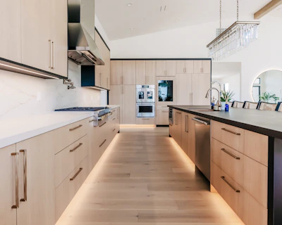 Modern kitchen with light wood cabinets and island