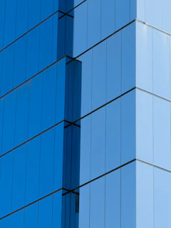 Modern blue glass skyscraper facade detail