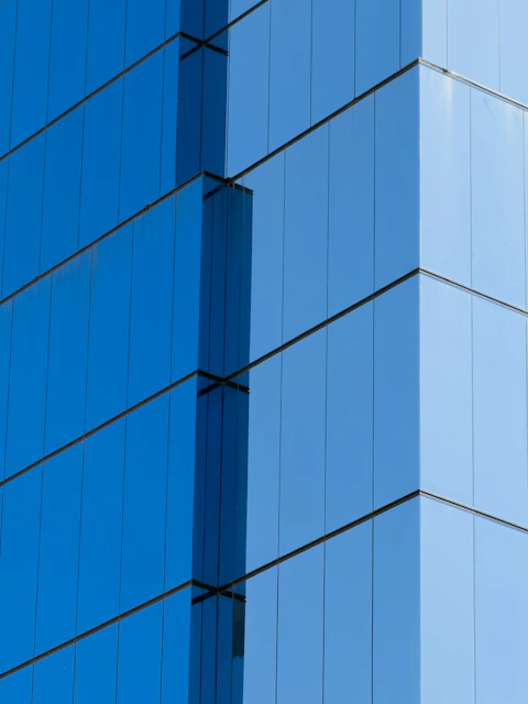 Modern blue glass skyscraper facade detail