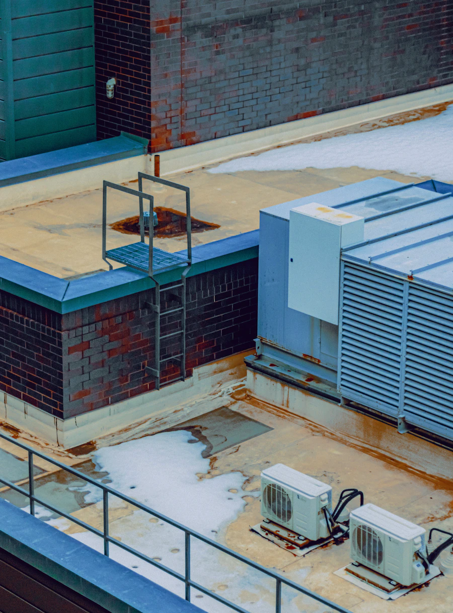 Rooftop commercial HVAC units and mechanical equipment on a downtown building