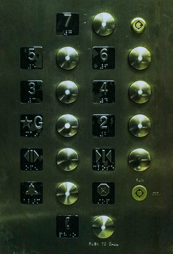 Elevator control panel with numbered buttons