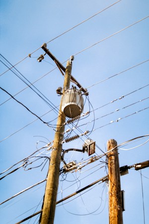 High-voltage power lines standing in open dirt, similar to the electric infrastructure a large data center campus in the Nevada desert requires