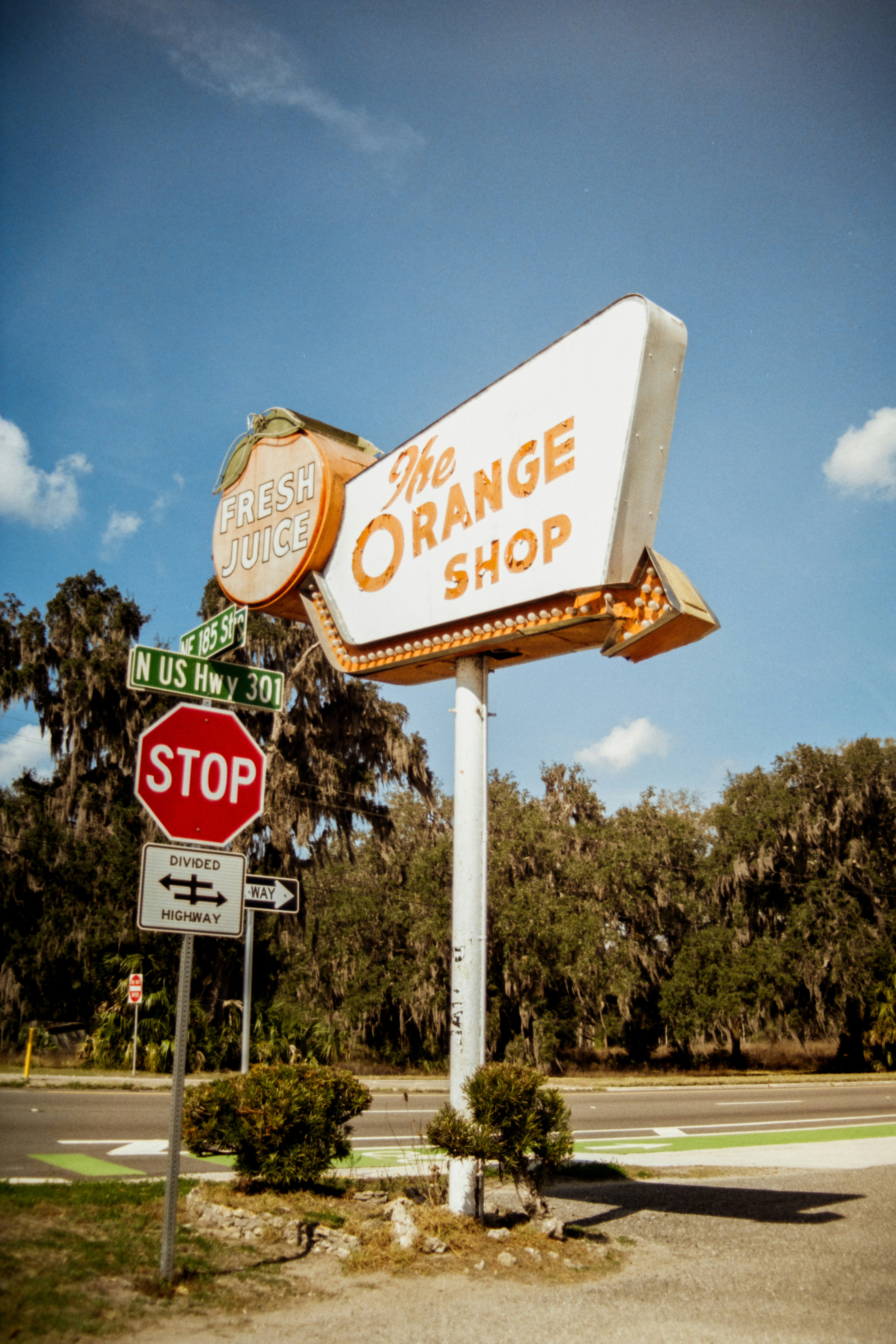The orange shop roadside sign with stop sign