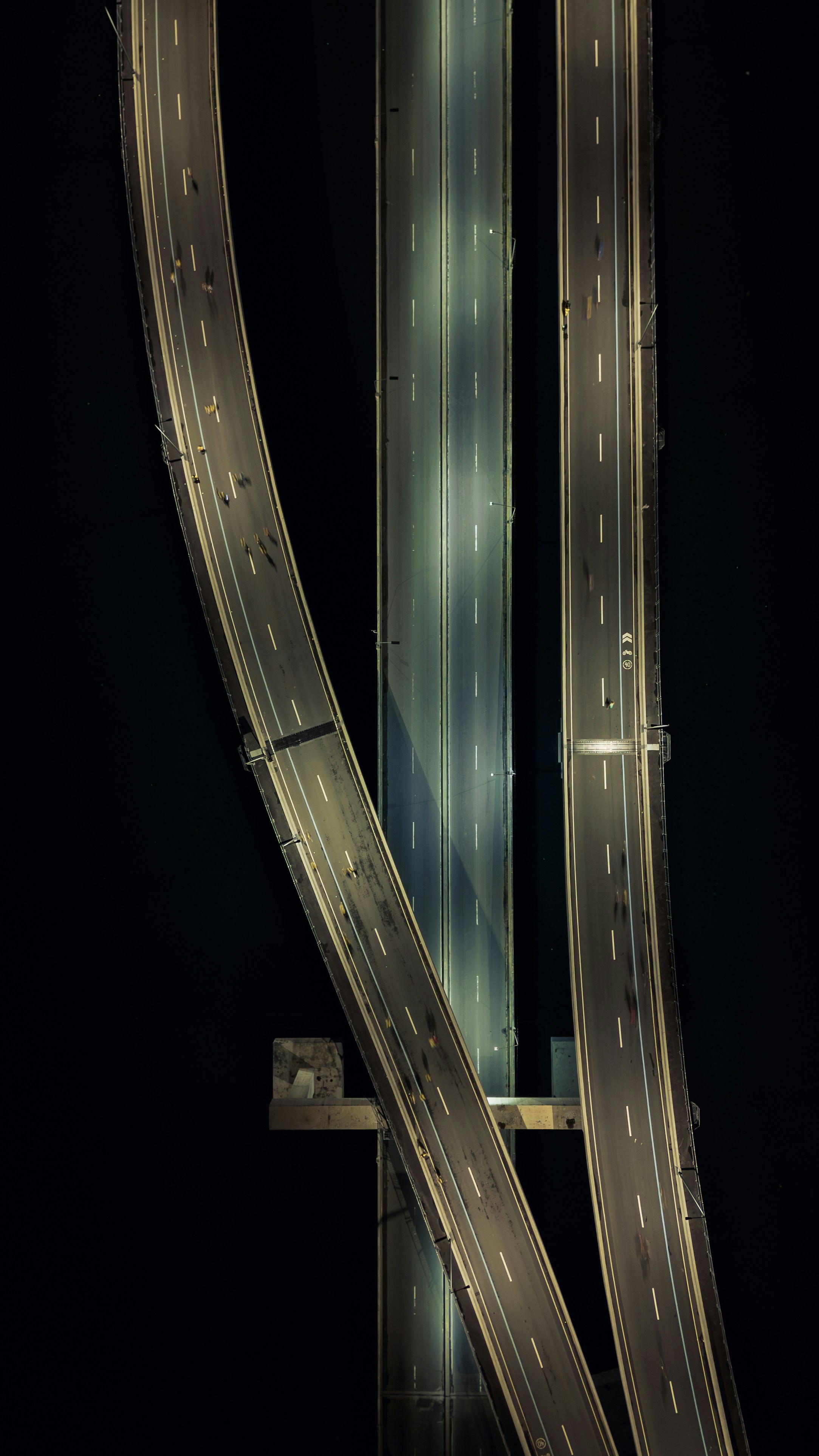 Aerial view of illuminated highways at night