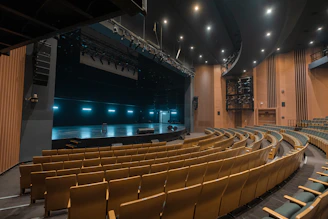 Empty theater auditorium with stage and seating